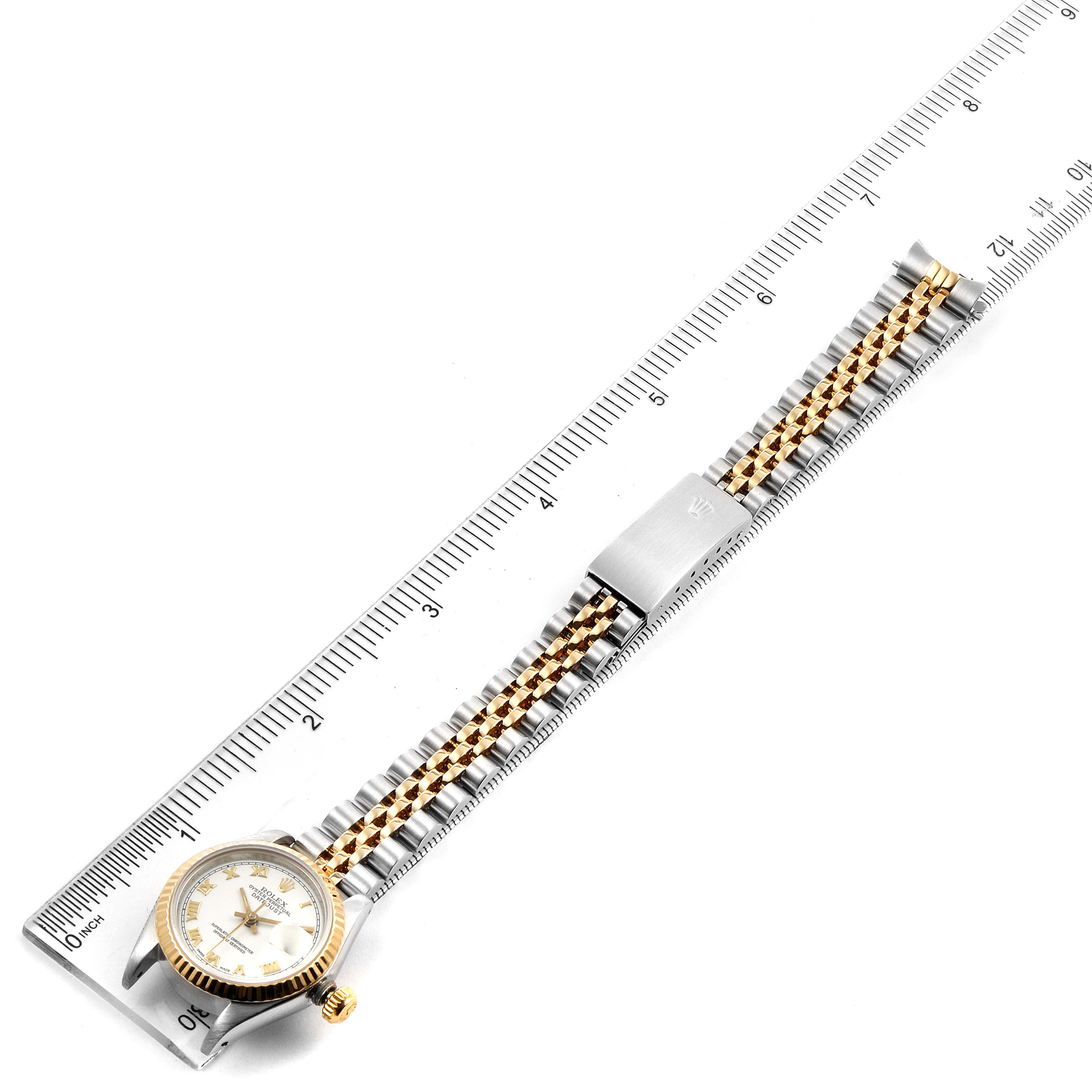 The image shows a top-down view of a Rolex Datejust 69173 Women's Steel and Gold (two tone) White Dial 69173 Women's Steel and Gold (two tone) White Dial watch, measuring its band with a ruler.