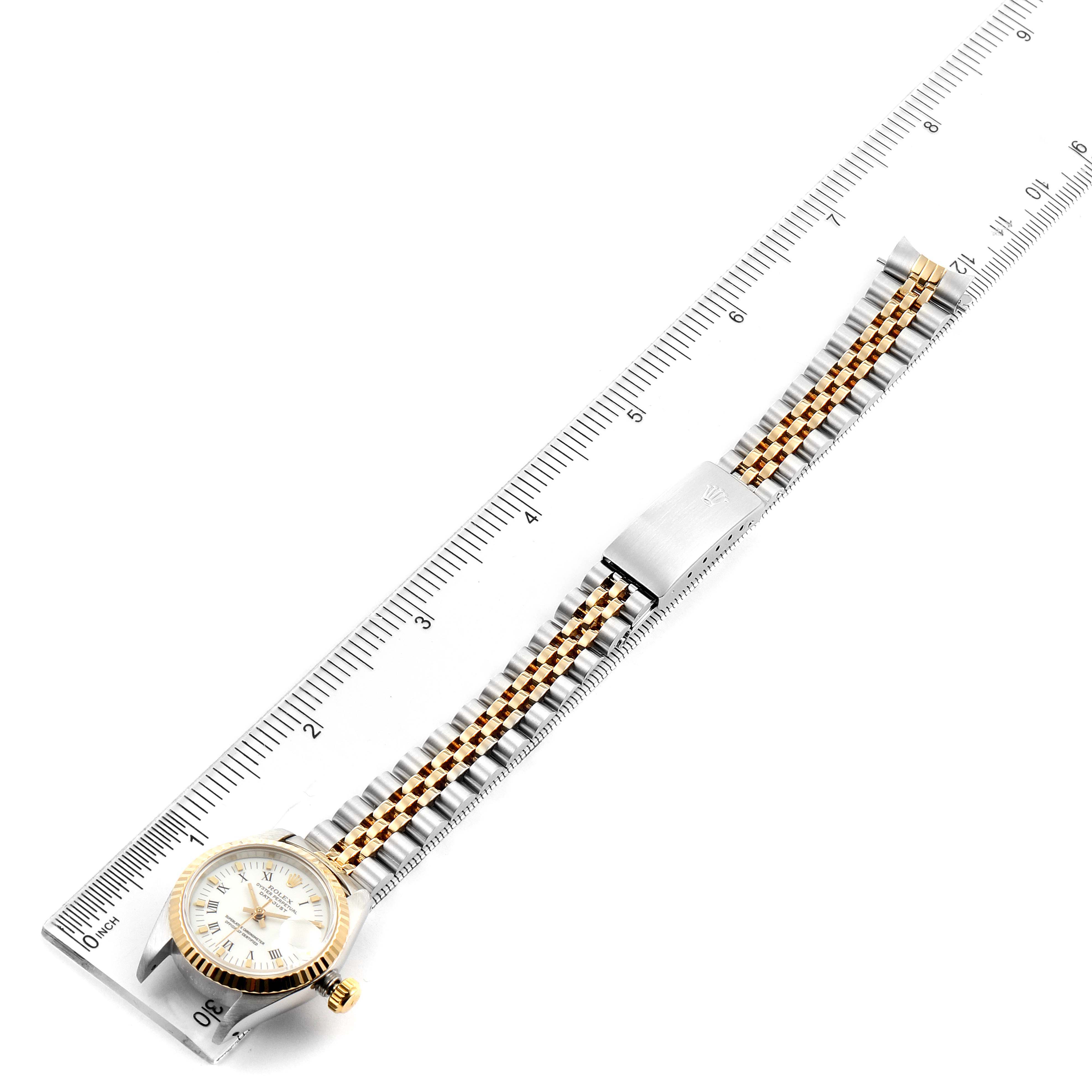 The image shows an overhead view of a Rolex Datejust 69173 Women's Steel and Gold (two tone) White Dial 69173 Women's Steel and Gold (two tone) White Dial watch with its face, bezel, and bracelet clearly visible alongside a ruler.