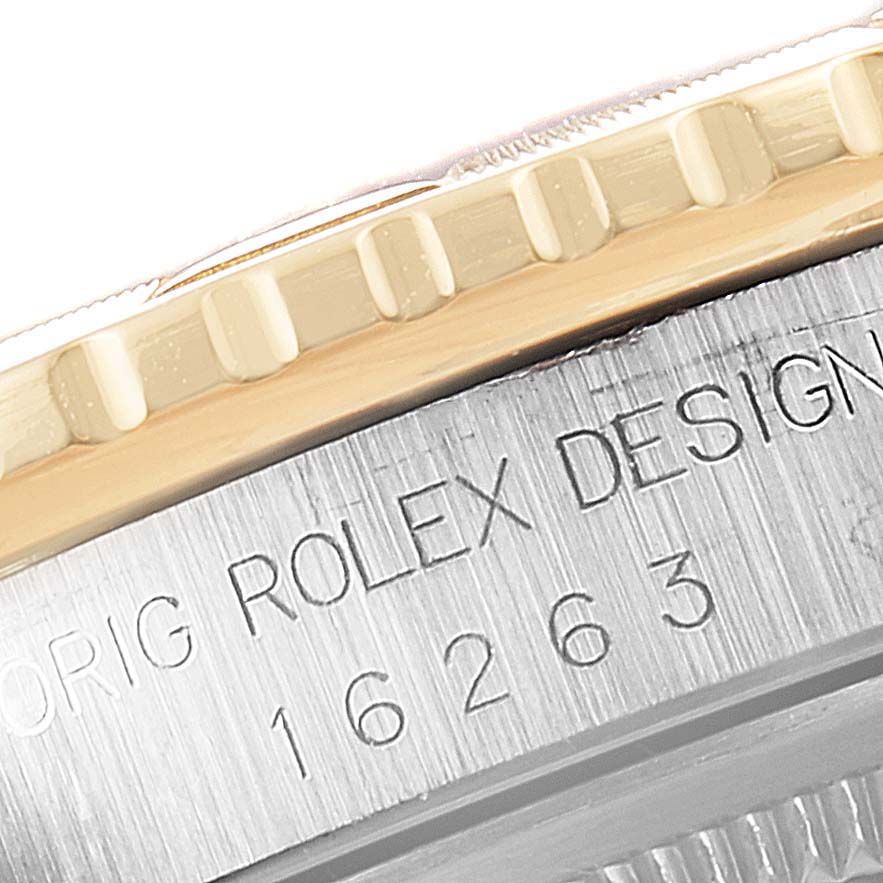 The image shows a close-up of the side of a Rolex Turn-o-Graph 16263 Men
s Steel and Gold (two tone) Champagne Dial 16263 Men
s Steel and Gold (two tone) Champagne Dial watch, highlighting the bezel and engraved case detailing.