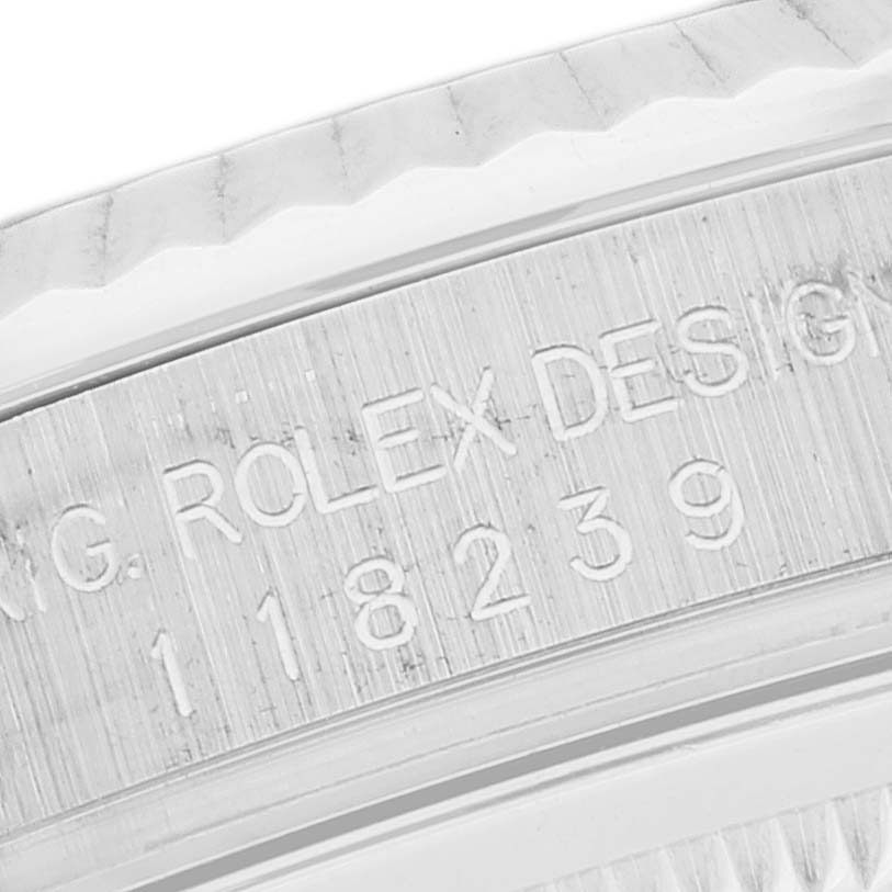 This close-up image shows the bezel and part of the casing with the engraved Rolex model and serial number of a Rolex President 118239 Men's White Gold Pink Dial 118239 Men's White Gold Pink Dial watch.