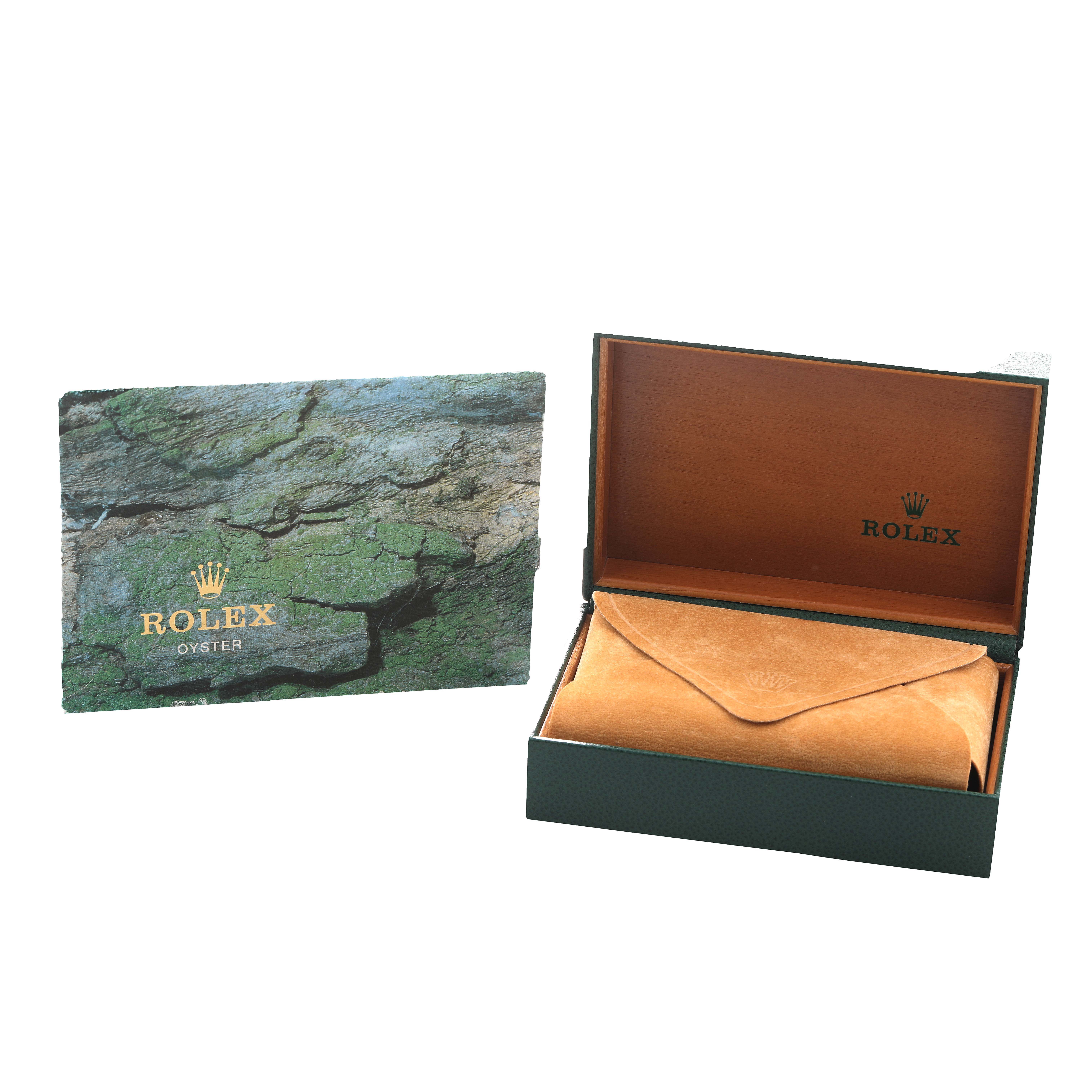 The image shows a Rolex Daytona 16520 Men's Stainless Steel White Dial box and pouch at an angle, with a textured card alongside.