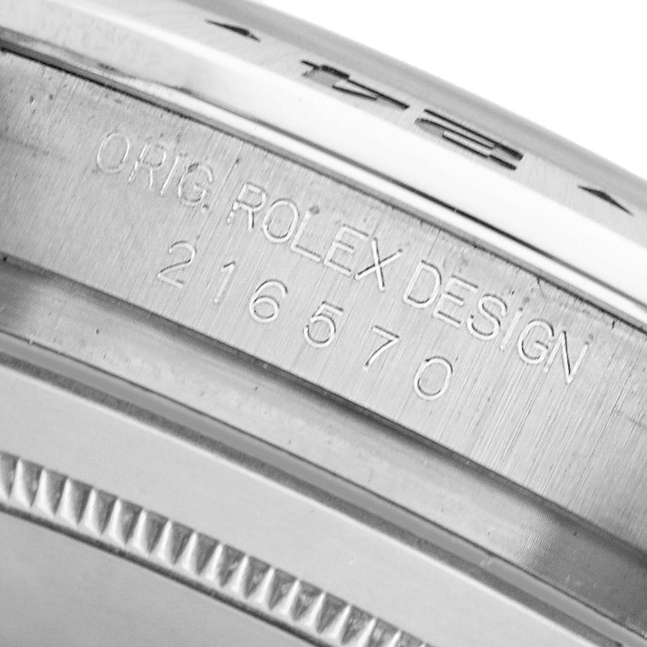 The image shows a close-up of the engraved inner bezel of a Rolex Explorer 216570 Men's Stainless Steel White Dial, displaying the model number "216570."