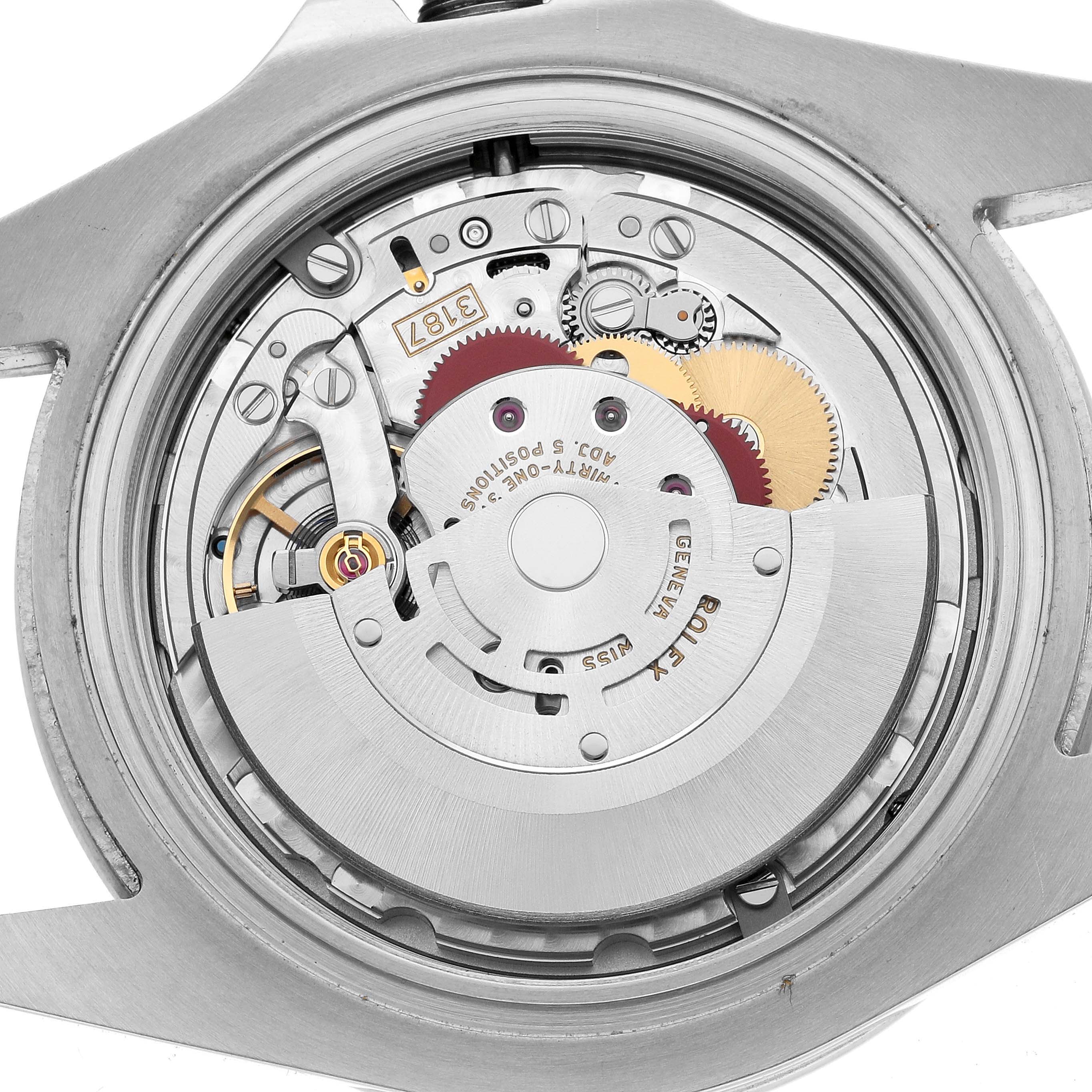 The image shows a close-up view of the movement mechanism inside a Rolex Explorer 216570 Men's Stainless Steel White Dial watch.