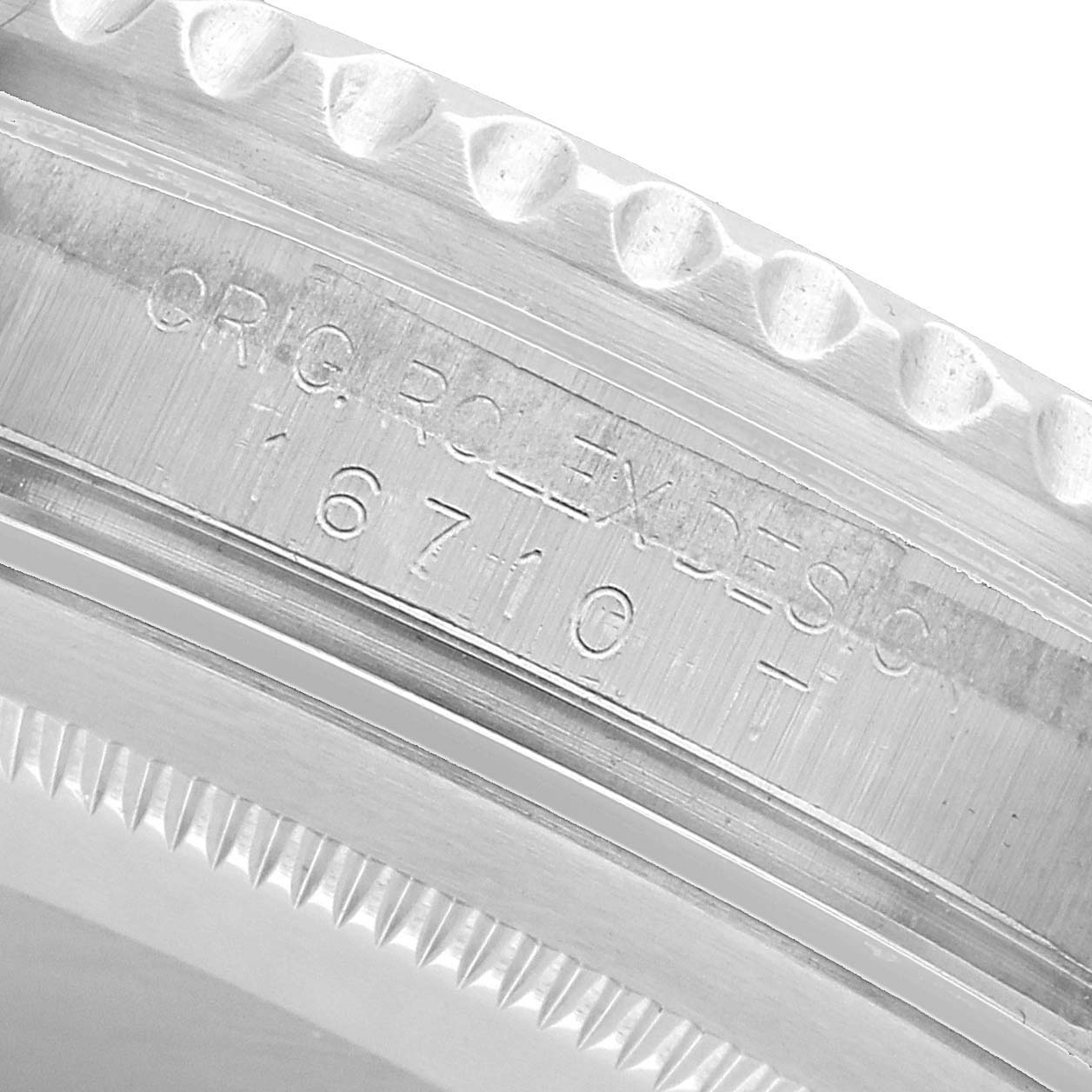 The image shows a close-up of the Rolex GMT-Master 16710 Men's Stainless Steel Black Dial model's inner bezel area with engraved model details.