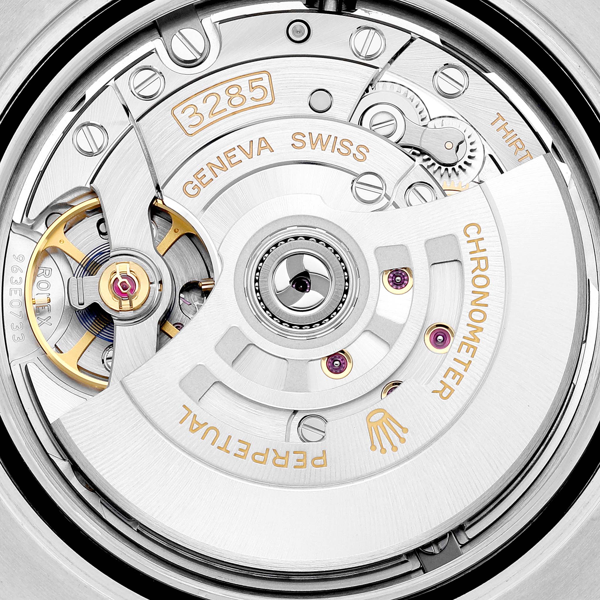 The image shows the intricate movement mechanism of a Rolex GMT-Master 126713 Men's Steel and Gold (two tone) Black Dial 126713 Men's Steel and Gold (two tone) Black Dial, displaying parts of the 3285 caliber.