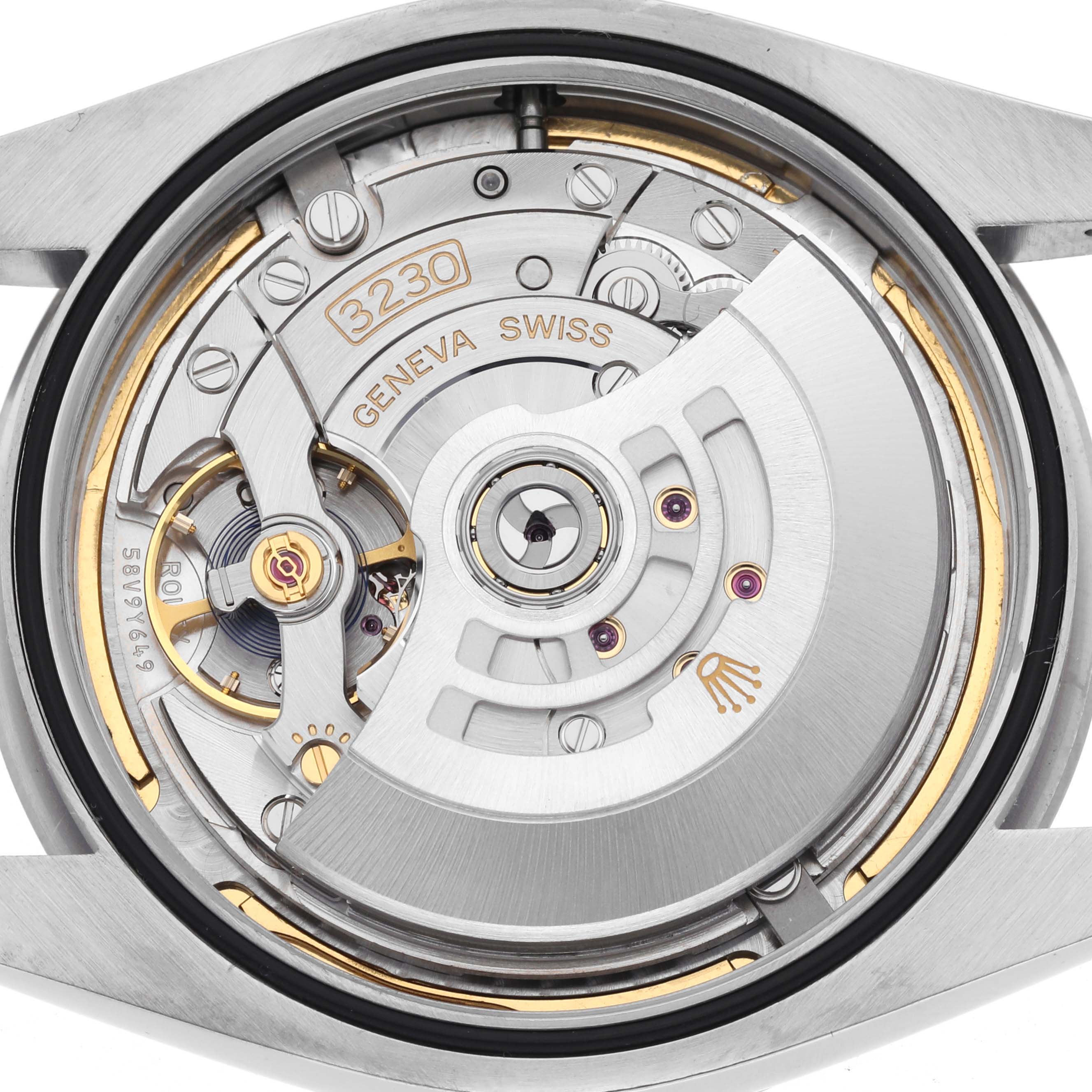 The image shows the back view of a Rolex Oyster Perpetual 124300 Men's Stainless Steel Blue Dial 124300 Men's Stainless Steel Blue Dial watch, highlighting its intricate movement and rotor.