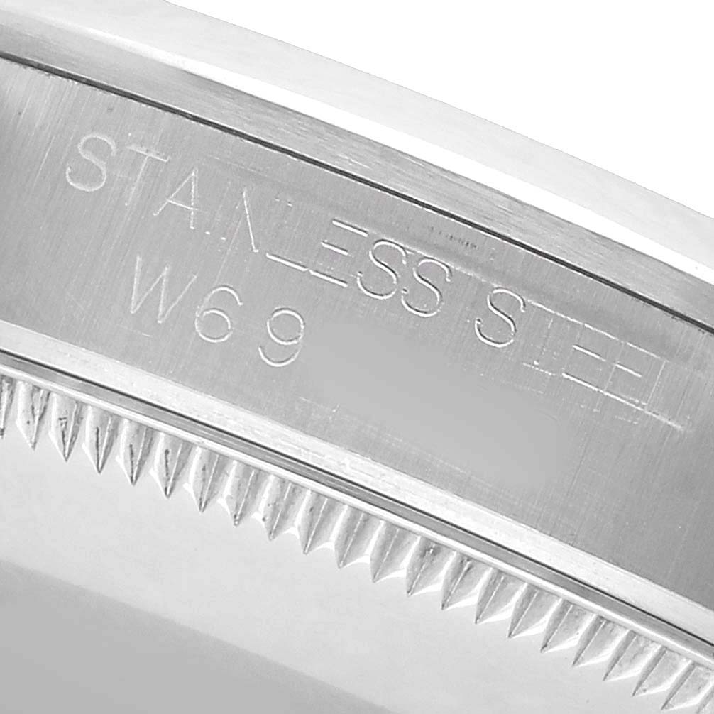 The image shows a close-up of the bezel edge and engravings on the Rolex Mid-Size 67480 Women's Stainless Steel Pink Dial model in stainless steel.