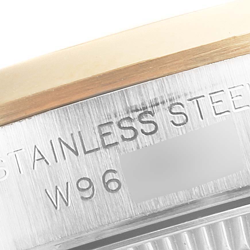 This is a close-up shot of the side of a Rolex Oyster Perpetual 76193 Women's Steel and Gold (two tone) Grey Dial 76193 Women's Steel and Gold (two tone) Grey Dial watch showing the text "STAINLESS STEEL."