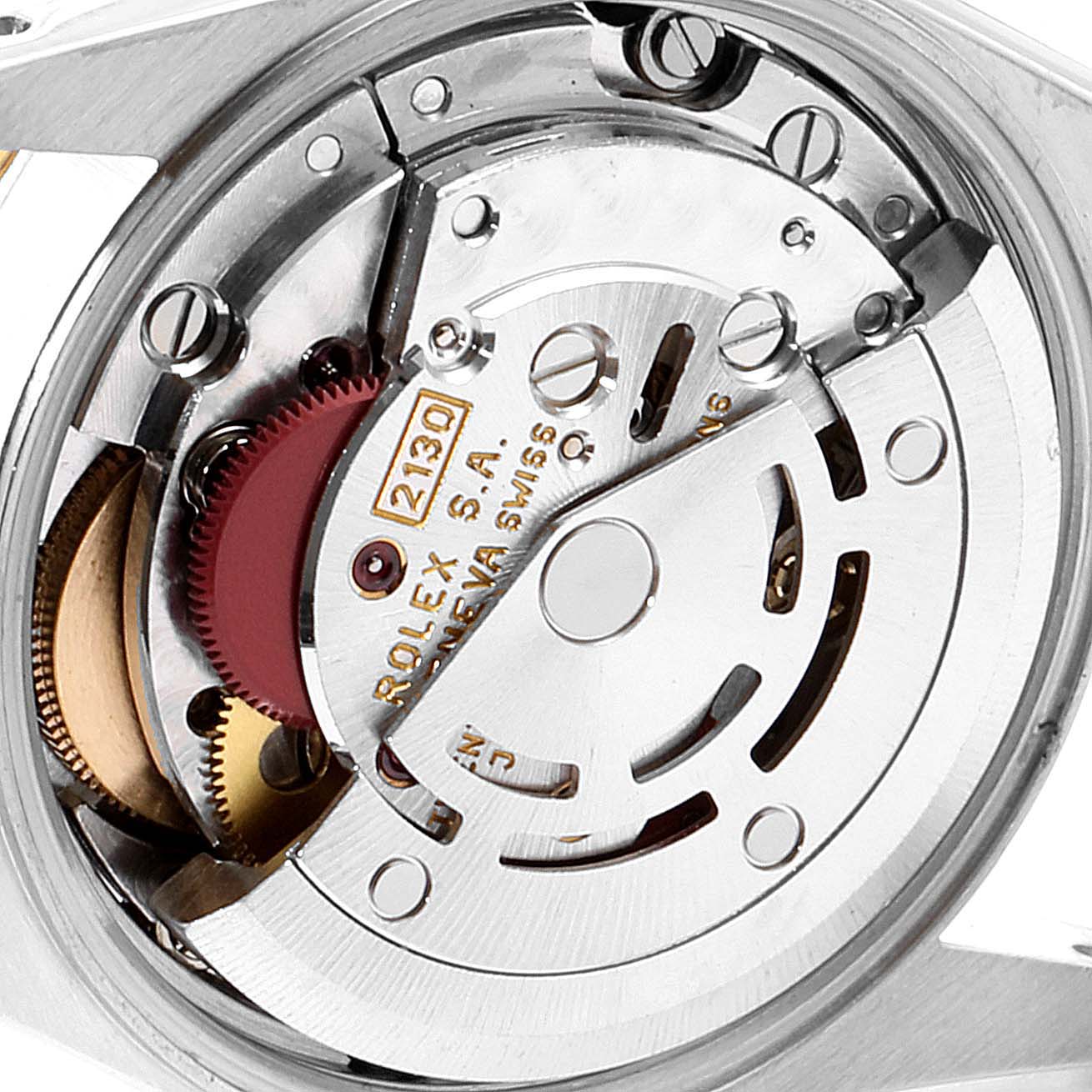 The image shows a close-up of the movement mechanism of a Rolex Oyster Perpetual 67193 Women
s Steel and Gold (two tone) Black Dial 67193 Women
s Steel and Gold (two tone) Black Dial watch.