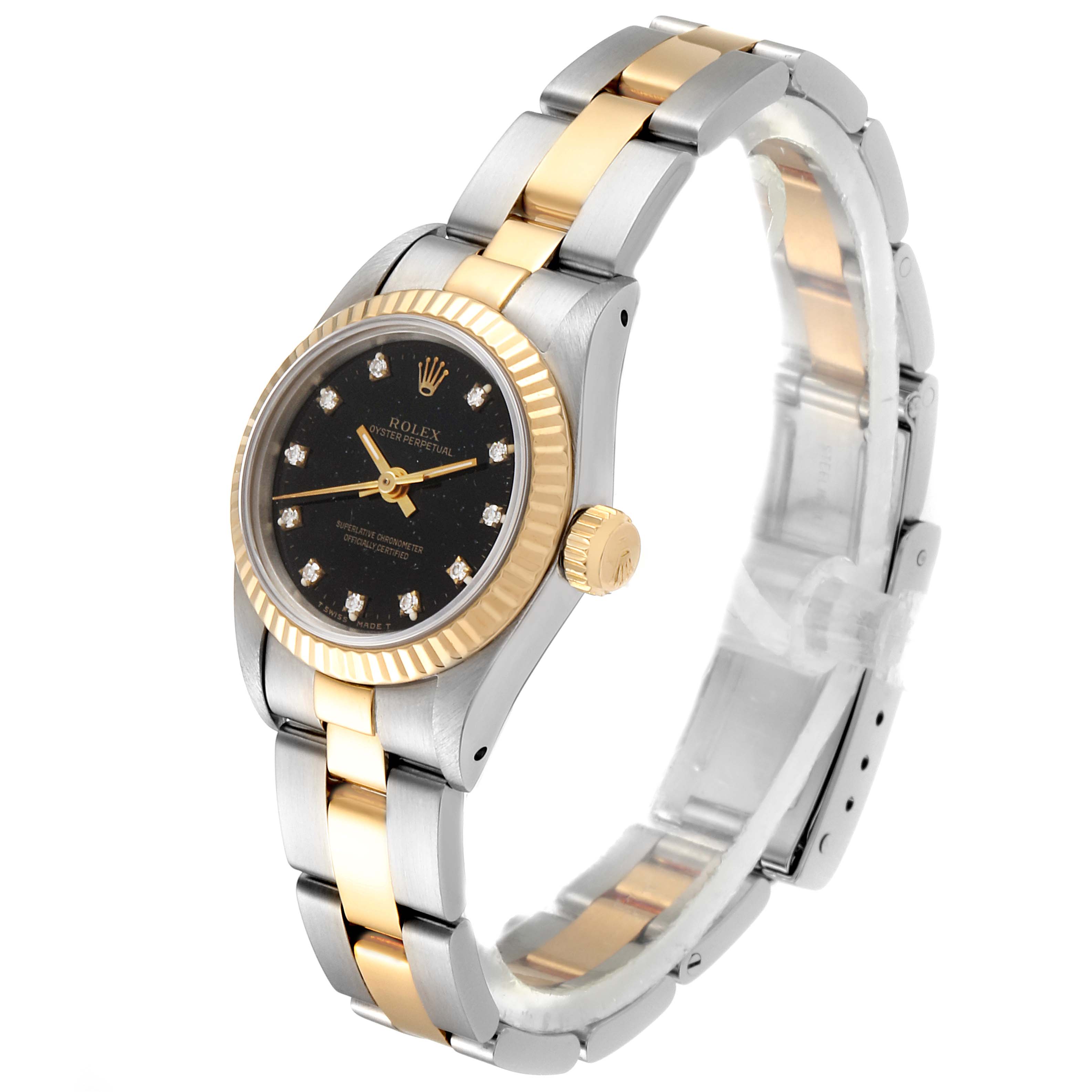 The Rolex Oyster Perpetual 67193 Women
s Steel and Gold (two tone) Black Dial 67193 Women
s Steel and Gold (two tone) Black Dial watch is shown at a three-quarter angle, highlighting its two-tone band, black dial, and diamond hour markers.