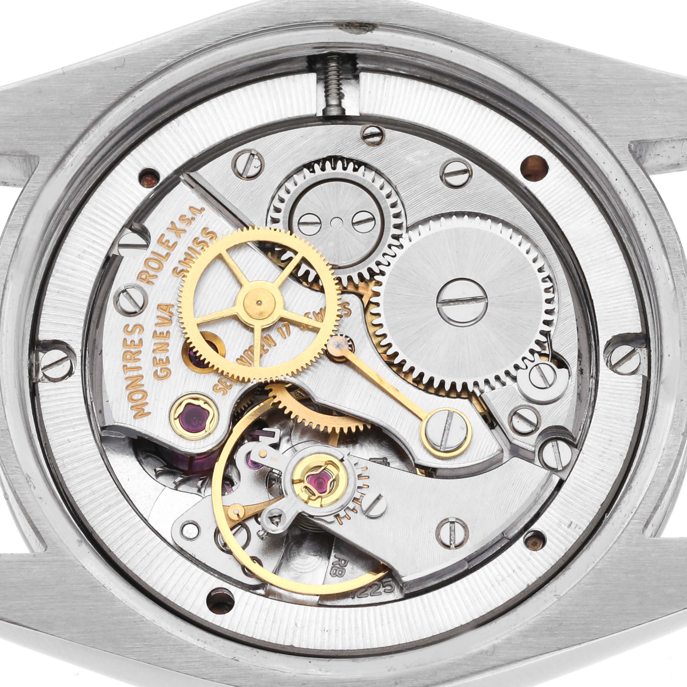 This image shows the intricate internal mechanisms of a Rolex Vintage Collection 6694 Men's Stainless Steel Pink Dial 6694 Men's Stainless Steel Pink Dial watch at a direct, top-down angle.