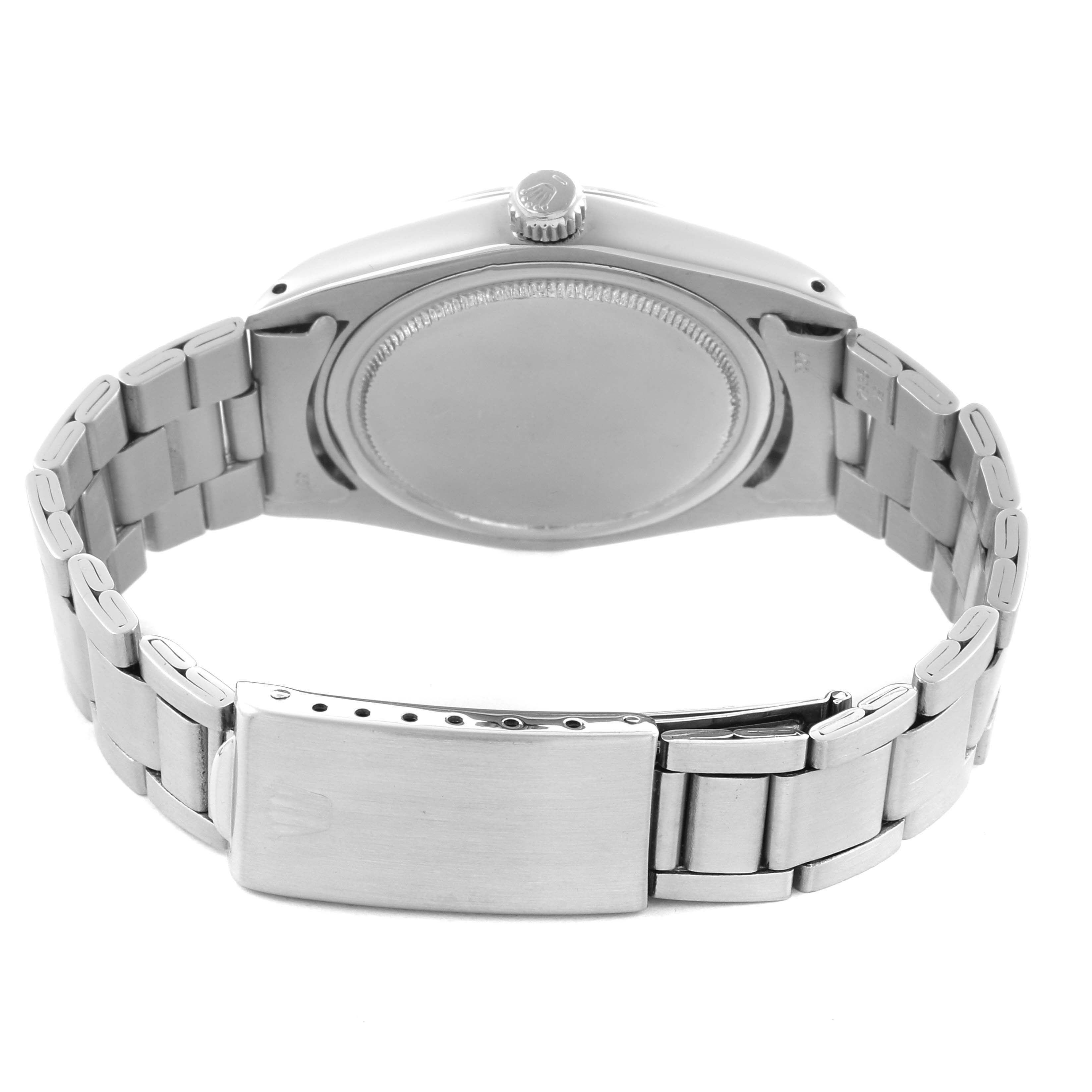 The Rolex Vintage Collection 6694 Men's Stainless Steel Pink Dial 6694 Men's Stainless Steel Pink Dial model is shown from the back, displaying the case back and metal bracelet with clasp.