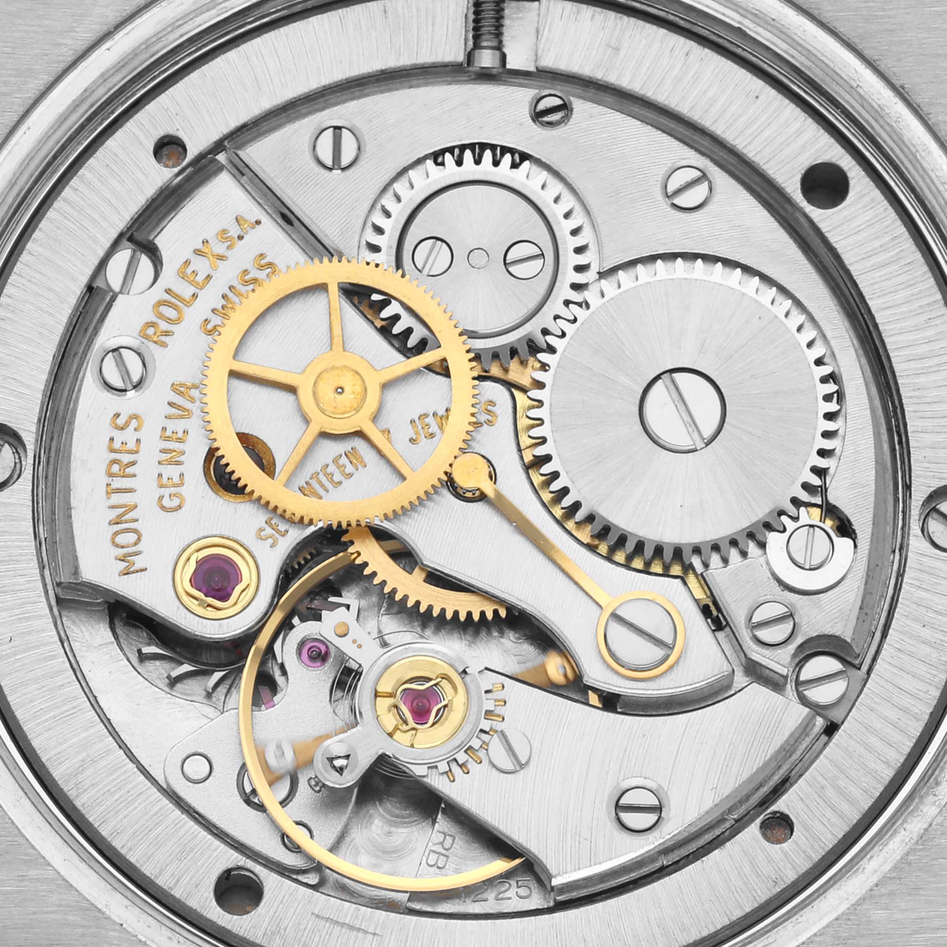 The image shows a close-up of the movement of a Rolex Vintage Collection 6694 Men's Stainless Steel Silver Dial watch, highlighting gears and jewels.