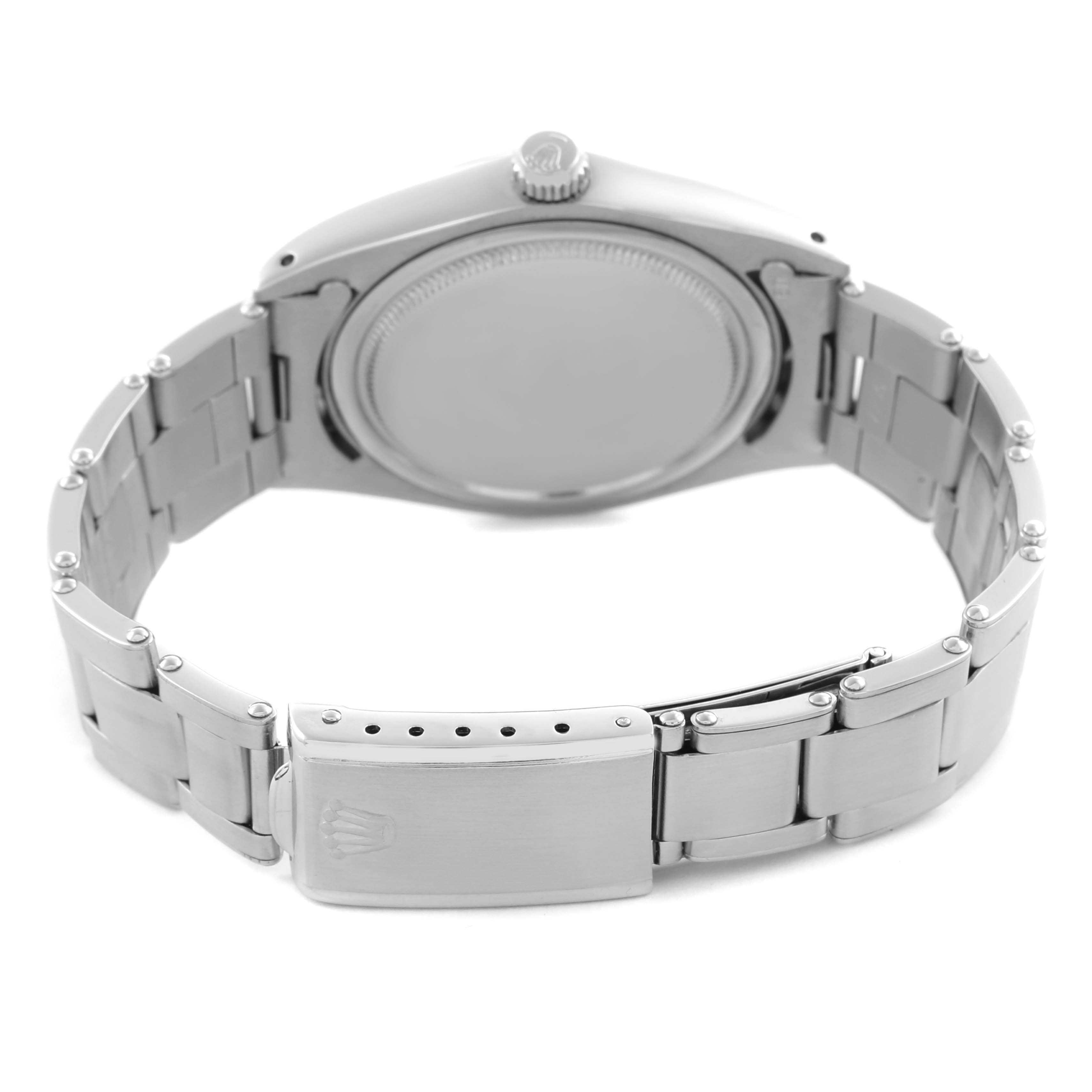 The image shows the back view of a Rolex Vintage Collection 6694 Men's Stainless Steel Silver Dial watch, highlighting the case back, bracelet, and clasp.