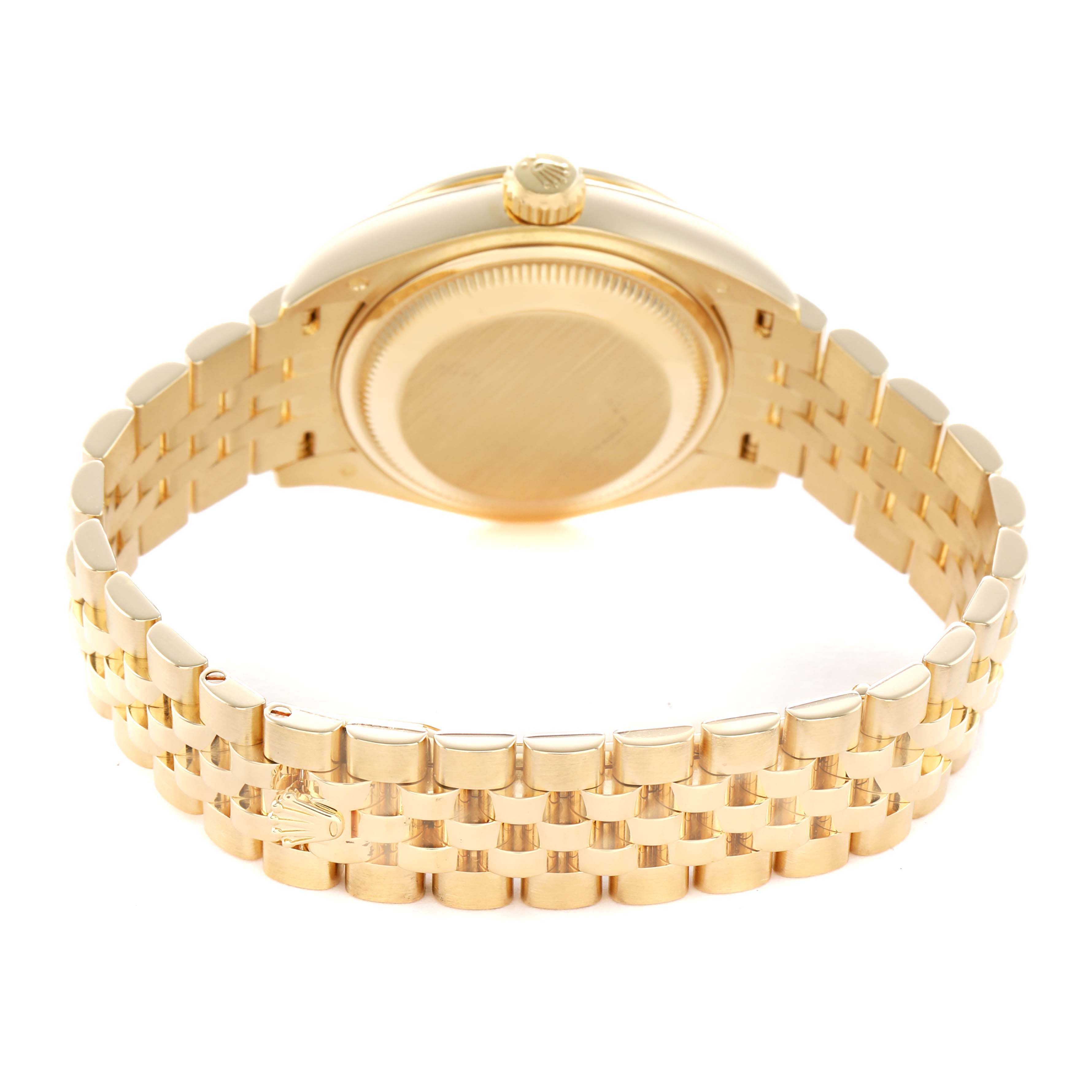 The Rolex President 279138 Women's Yellow Gold Champagne Dial watch is shown from the rear, highlighting the case back and gold bracelet.