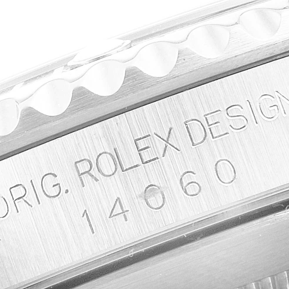 This close-up angle shows the engraved side of a Rolex Submariner 14060 Men
s Stainless Steel Black Dial 14060 Men
s Stainless Steel Black Dial, highlighting the model number 14060.