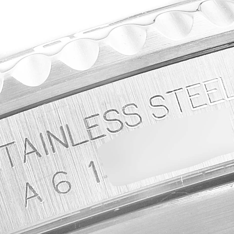 The image shows a close-up of the steel bezel and inner rim detailing with engraved text on a Rolex Submariner 14060 Men
s Stainless Steel Black Dial 14060 Men
s Stainless Steel Black Dial watch.