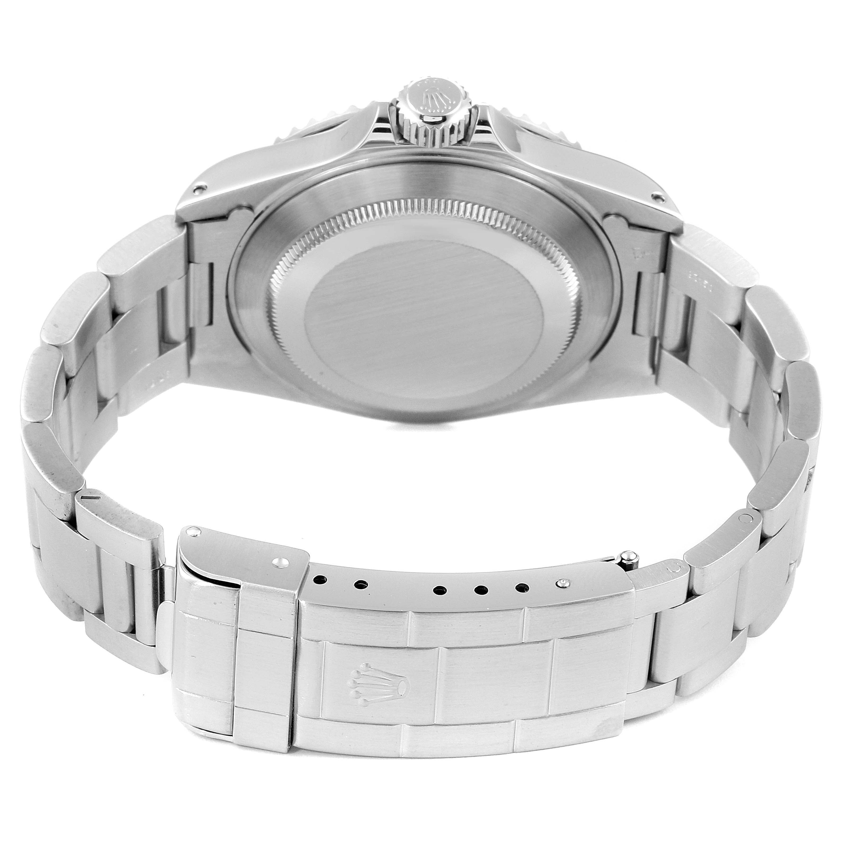 The image shows the back view of a Rolex Submariner 14060 Men
s Stainless Steel Black Dial 14060 Men
s Stainless Steel Black Dial watch, highlighting the case back, crown, and metal bracelet with the clasp.