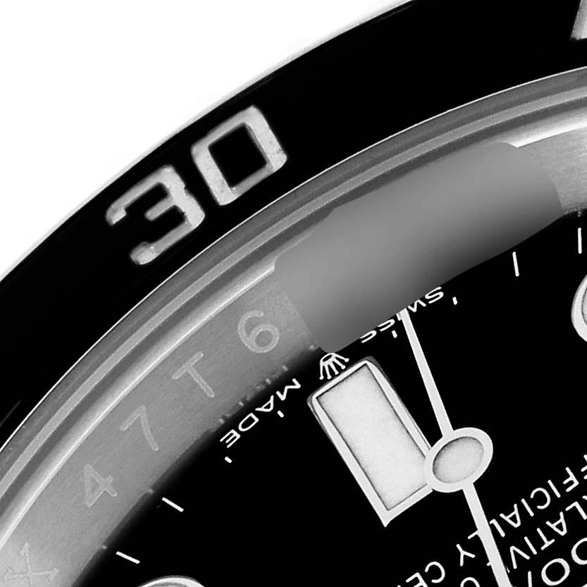 This close-up angle of the Rolex Submariner 126610LN Men
s Stainless Steel Black Dial 126610LN Men
s Stainless Steel Black Dial showcases parts of the bezel, dial, and a portion of the minute hand.