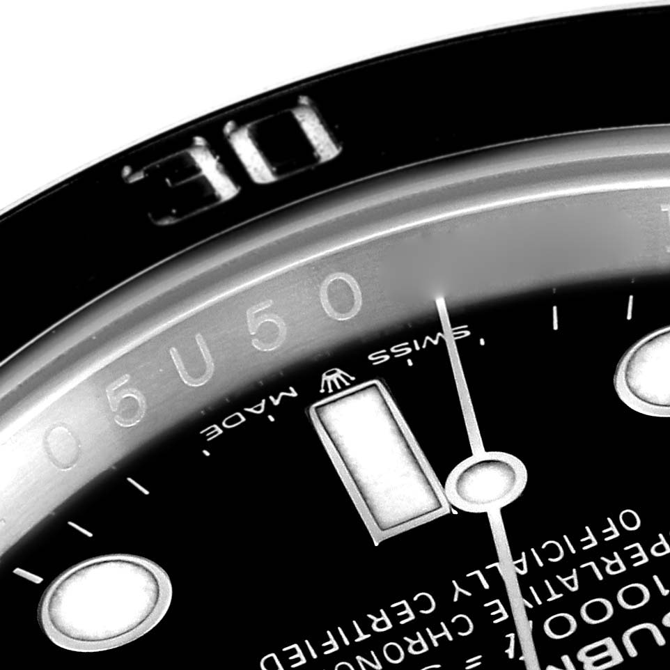 The image shows a close-up of the bezel and part of the dial of a Rolex Submariner 126610LN Men
s Stainless Steel Black Dial 126610LN Men
s Stainless Steel Black Dial watch, highlighting the "30" minute marker, and part of the numerals.