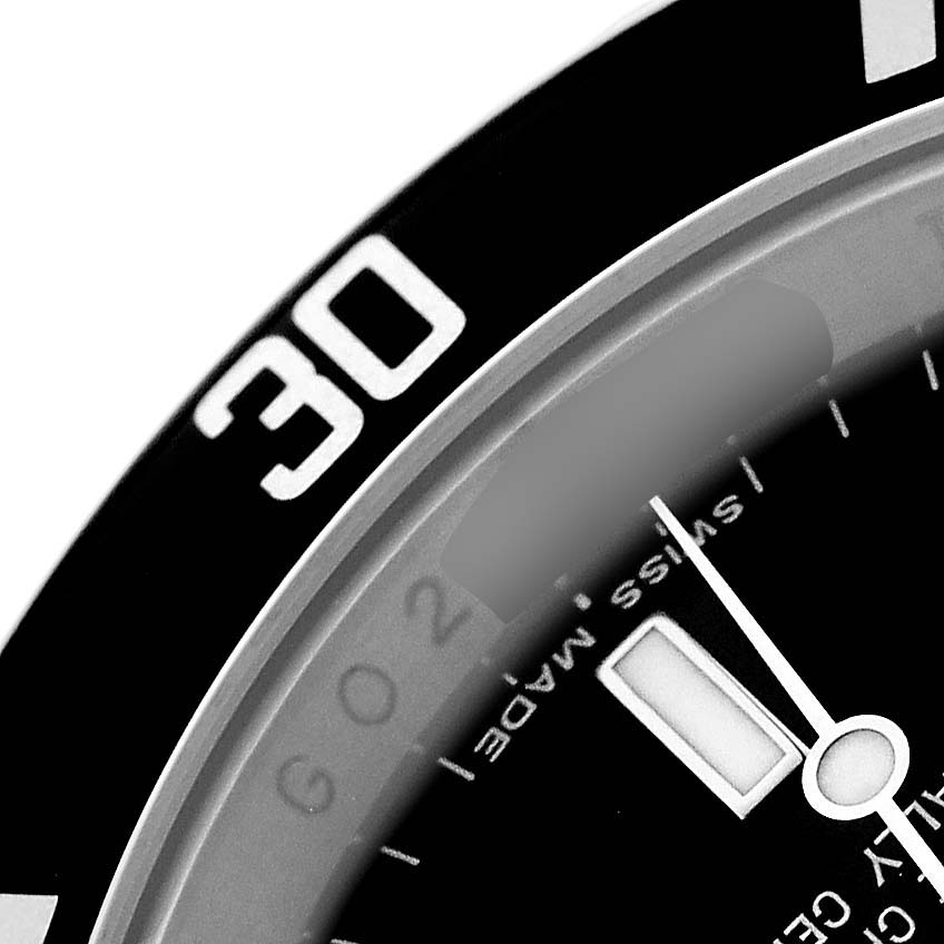 The image shows a close-up of the Rolex Submariner 16610 Men's Stainless Steel Black Dial's bezel and part of the dial, focusing on the 30-minute marker.