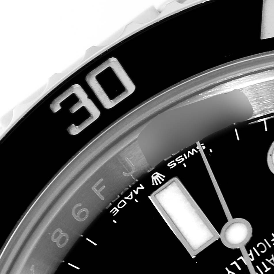 The image shows a close-up of the bezel and part of the face and hand of a Rolex Submariner 124060 Men
s Stainless Steel Black Dial 124060 Men
s Stainless Steel Black Dial watch.