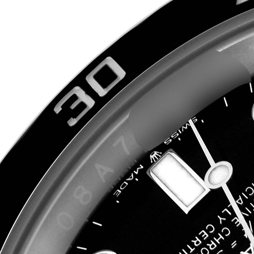 This close-up image of a Rolex Submariner 124060 Men
s Stainless Steel Black Dial 124060 Men
s Stainless Steel Black Dial watch shows part of the bezel with the "30" marker and a portion of the watch face.