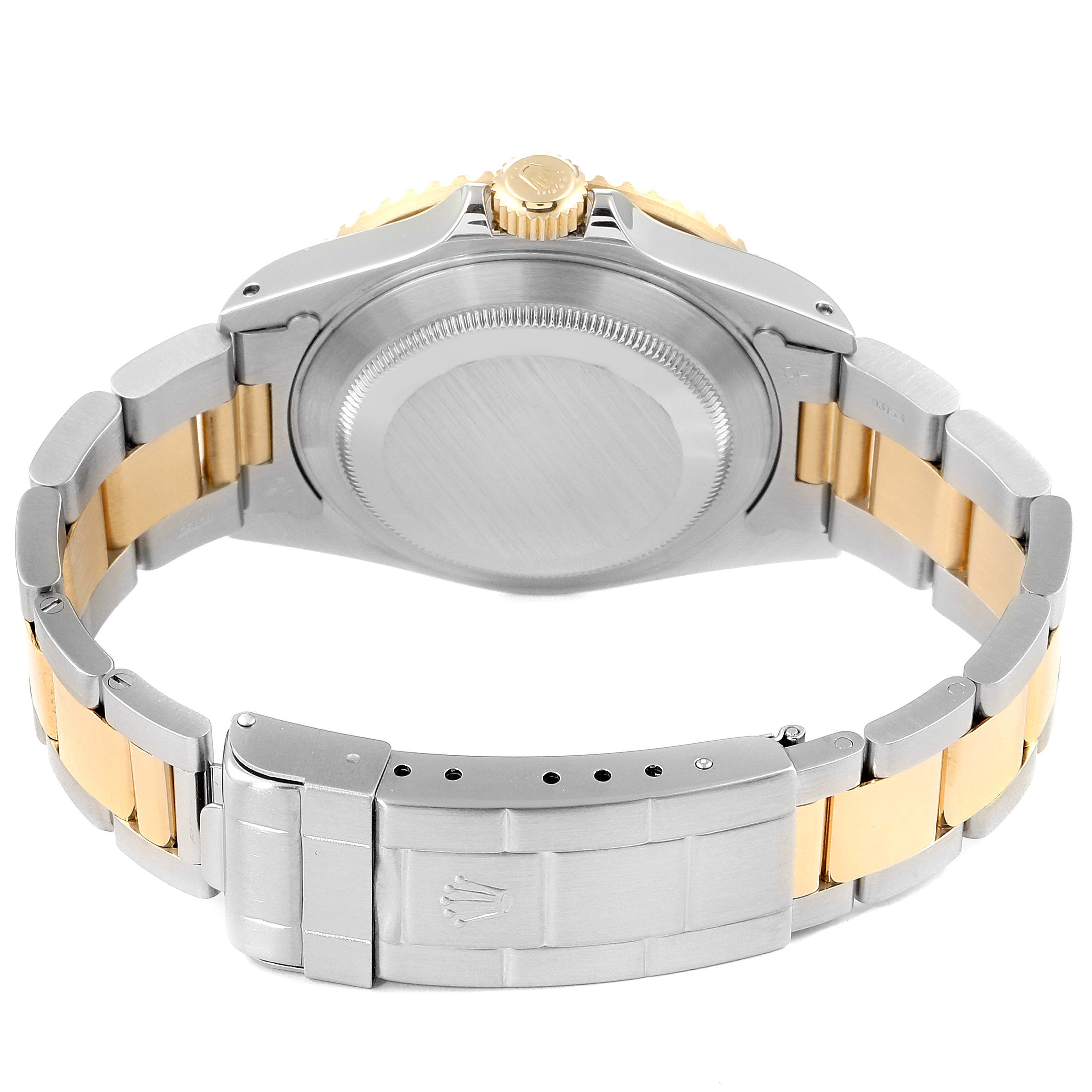 This image shows the back case and bracelet of a Rolex Submariner 16613 Men's Steel and Gold (two tone) Blue Dial 16613 Men's Steel and Gold (two tone) Blue Dial watch from a rear angle.