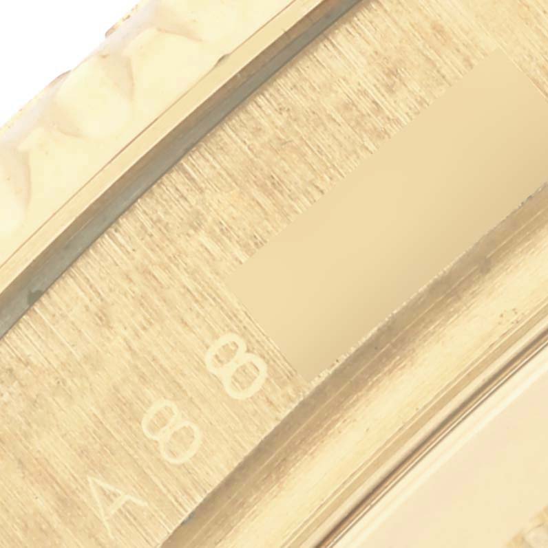 The image shows a close-up of the Yacht-Master bezel and markings, emphasizing texture and detail.