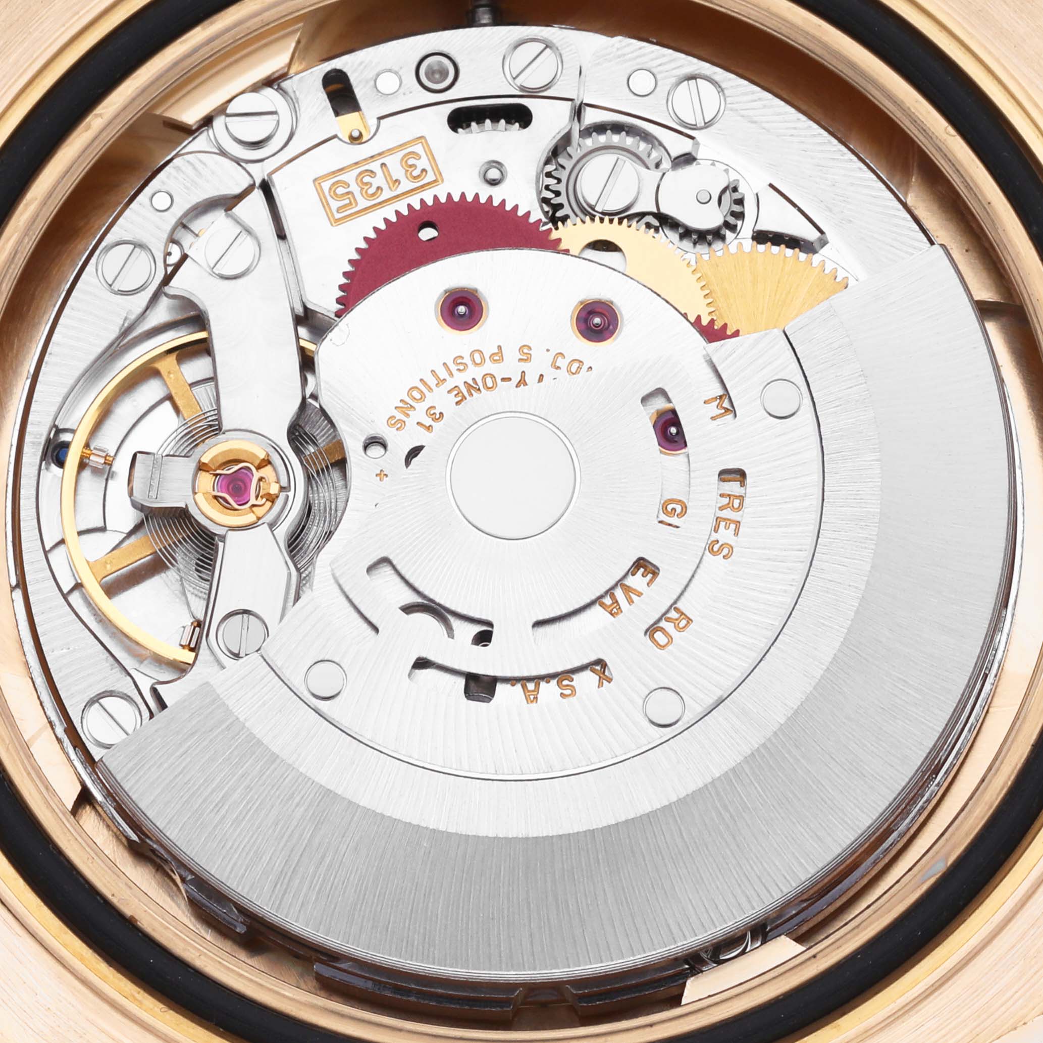 The image shows a close-up of the Rolex Yacht-Master 16628 Men's Yellow Gold White Dial 16628 Men's Yellow Gold White Dial's movement, highlighting the intricate gears and rotor from the back.