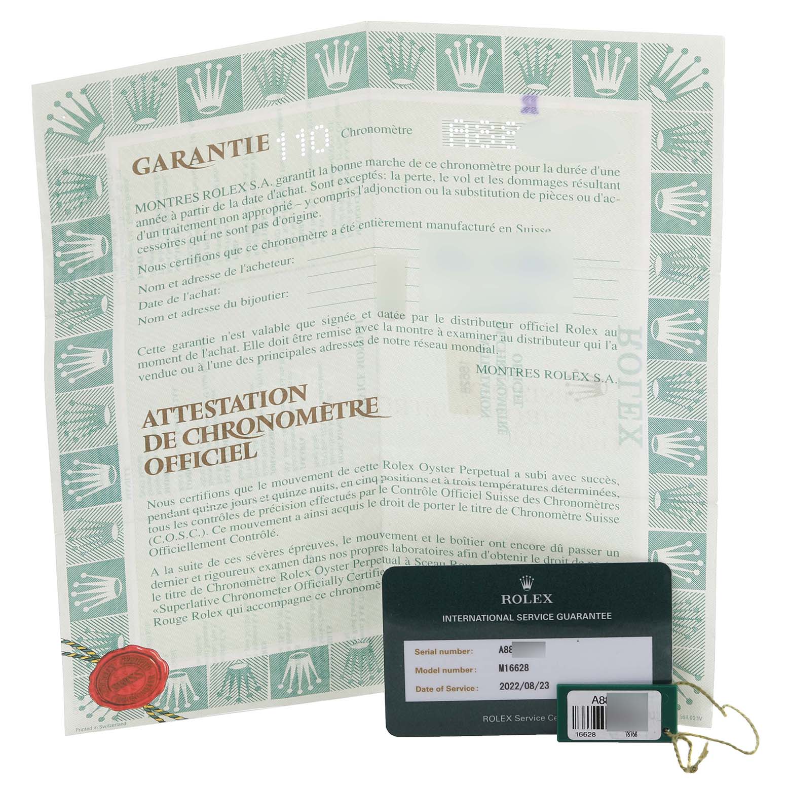 The image shows the warranty card and documentation for a Rolex Yacht-Master 16628 Men's Yellow Gold White Dial 16628 Men's Yellow Gold White Dial watch.