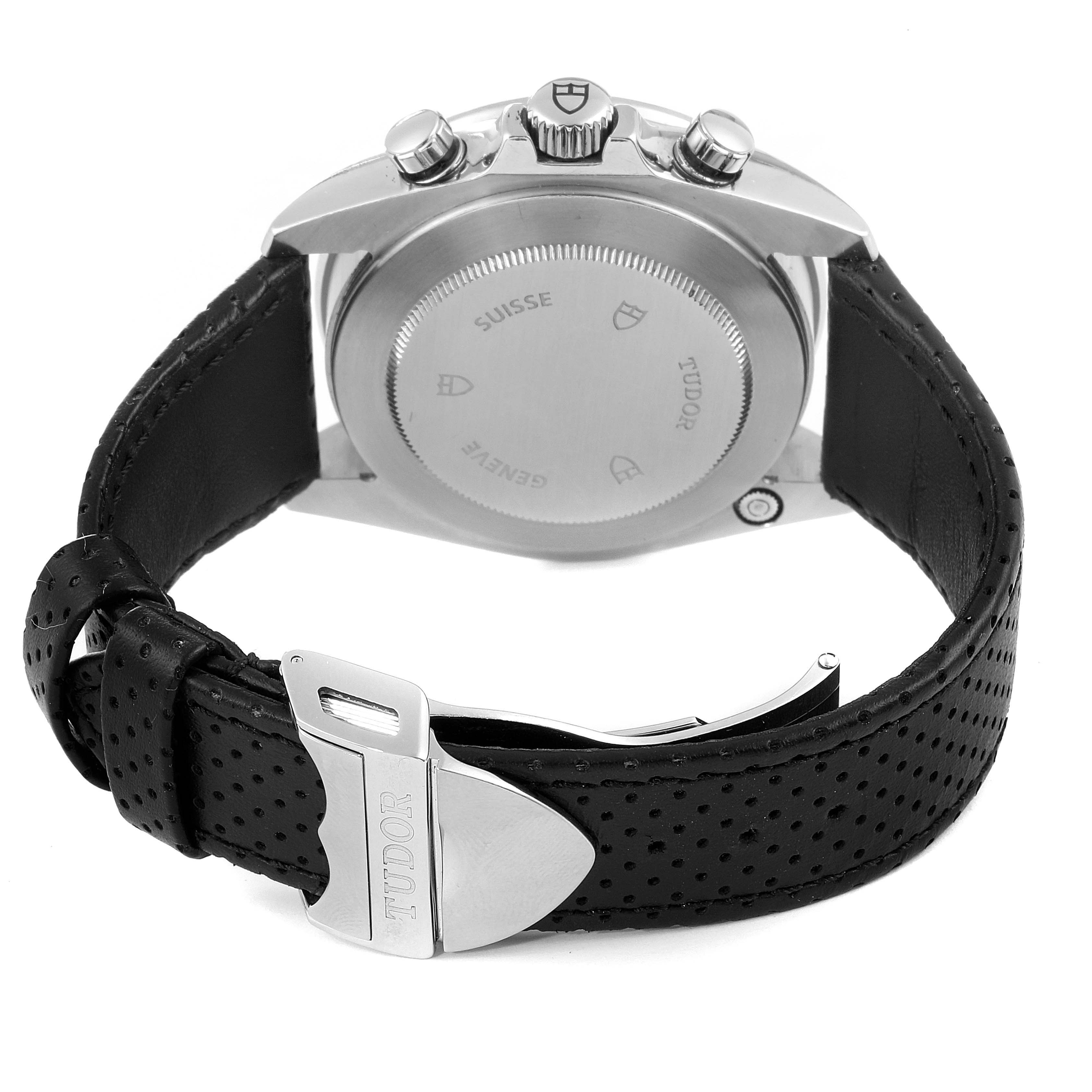 The image shows the back case and perforated leather strap of a Tudor Grantour 20530N Men
s Stainless Steel Silver Dial 20530N Men
s Stainless Steel Silver Dial watch, viewed from the rear.