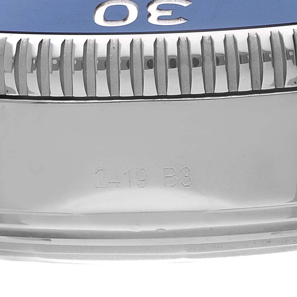 This image shows a close-up of the bezel and the engraved details on the casing of the Breitling Superocean A13313 Men's Stainless Steel Blue Dial A13313 Men's Stainless Steel Blue Dial watch.