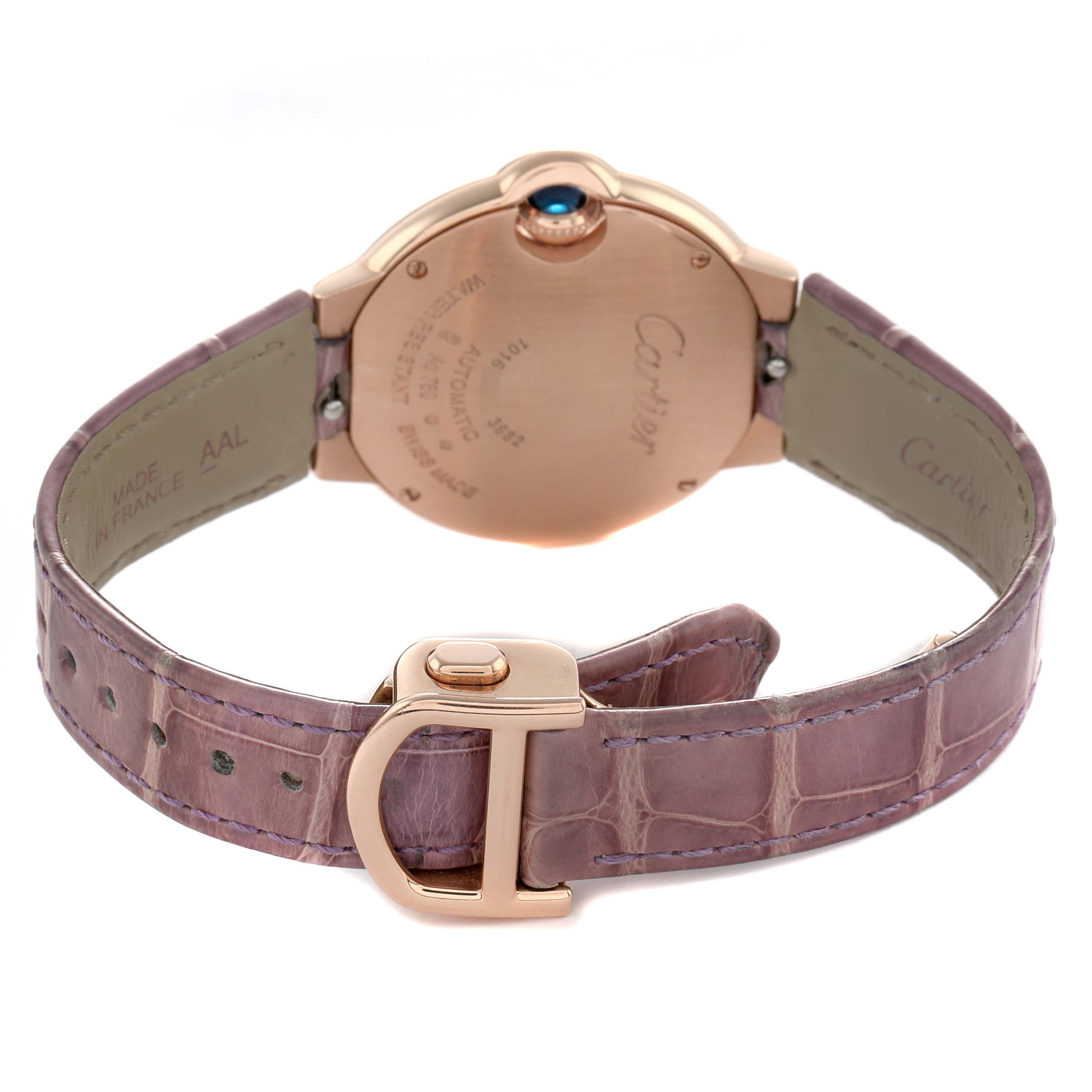 The image shows the back of the Cartier Ballon Bleu WE902066 Women's Rose Gold Silver Dial watch, highlighting the clasp, strap, and case back.