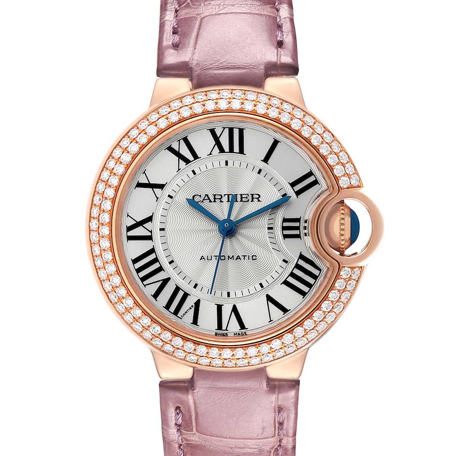 The Cartier Ballon Bleu WE902066 Women's Rose Gold Silver Dial watch is shown from the front, highlighting its round face, diamond bezel, and lavender strap.