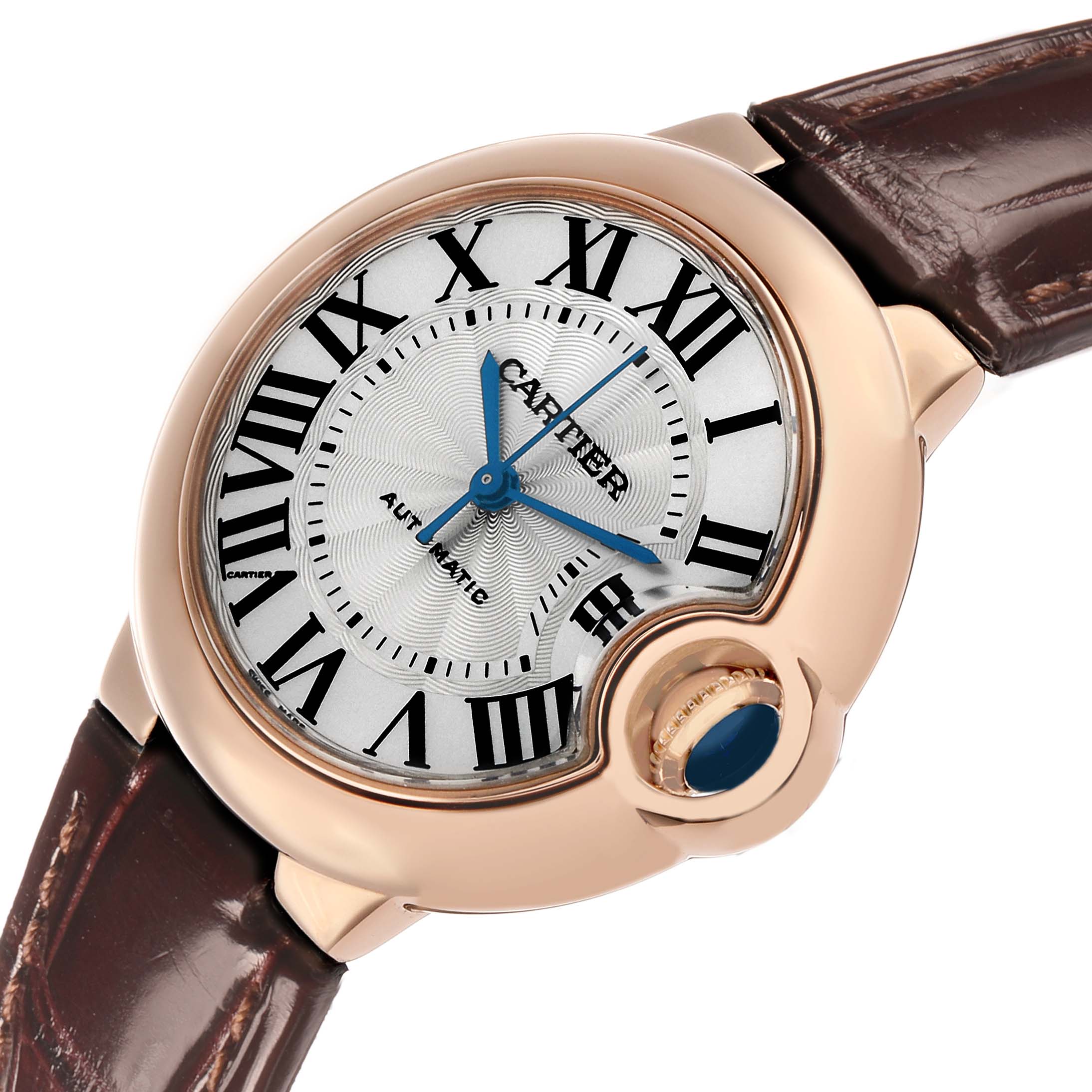 The image shows a top-side angle of the Cartier Ballon Bleu W6920097 Women's Rose Gold Silver Dial watch, highlighting the face, crown, and leather strap.