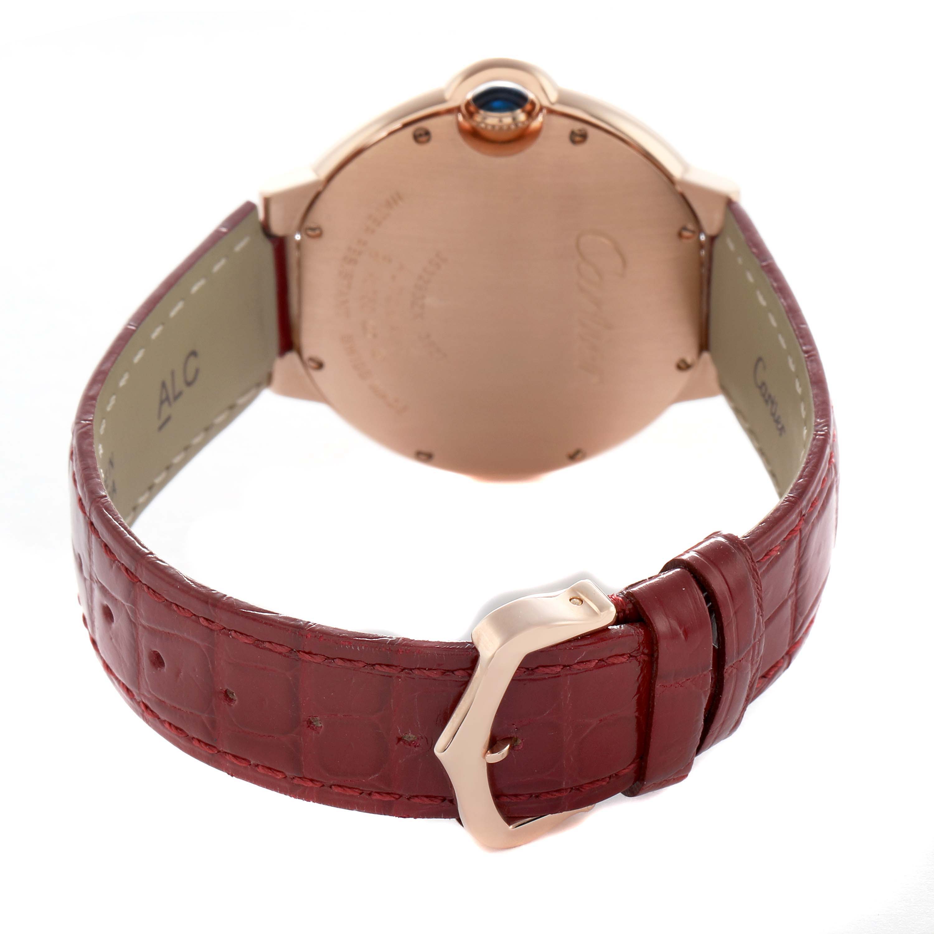 The image shows the back and side of the Cartier Ballon Bleu WJBB0034 Women's Rose Gold Silver Dial watch, highlighting the case back, crown, and red leather strap.