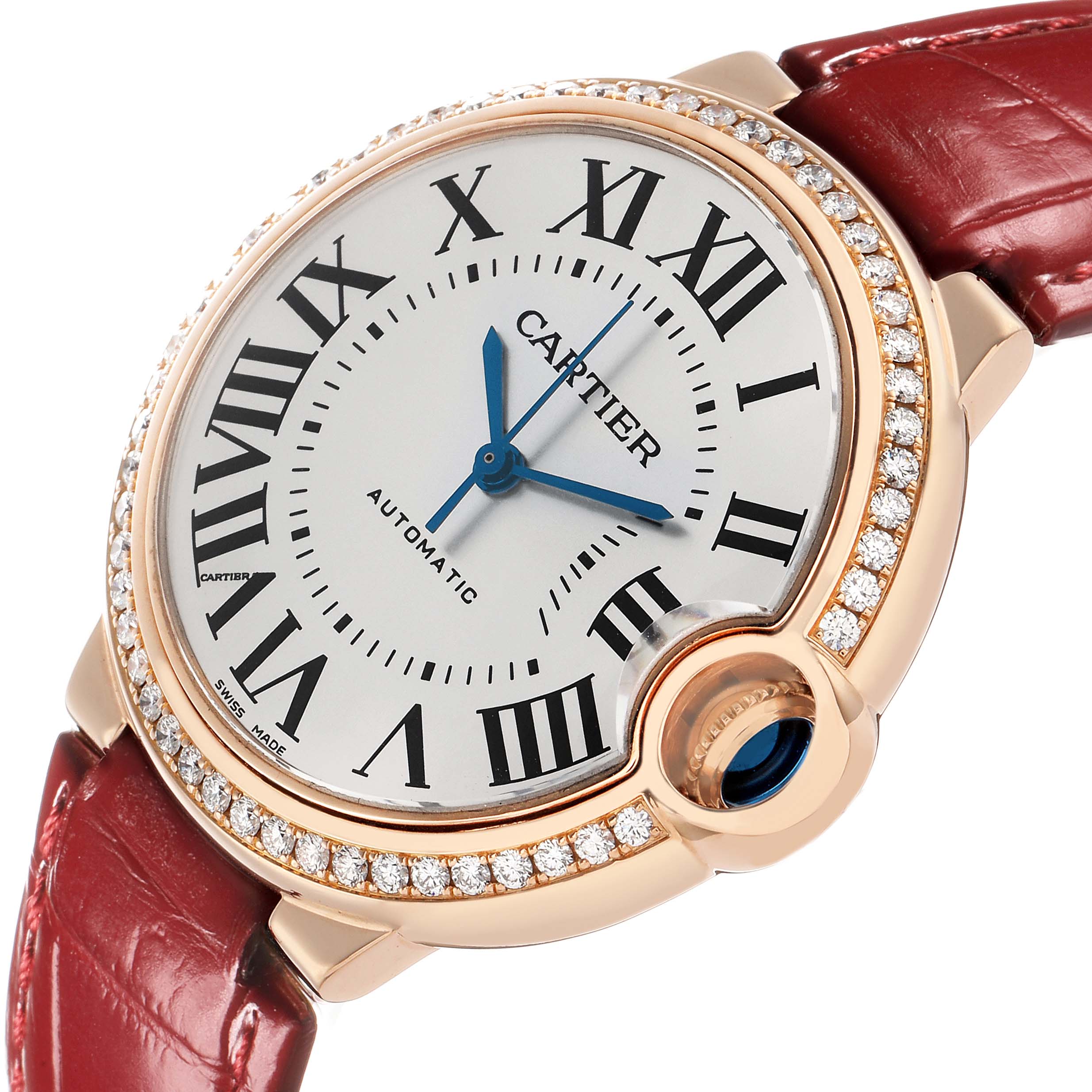 The Cartier Ballon Bleu WJBB0034 Women's Rose Gold Silver Dial watch is shown at an angle highlighting its diamond bezel, Roman numerals, and red strap.