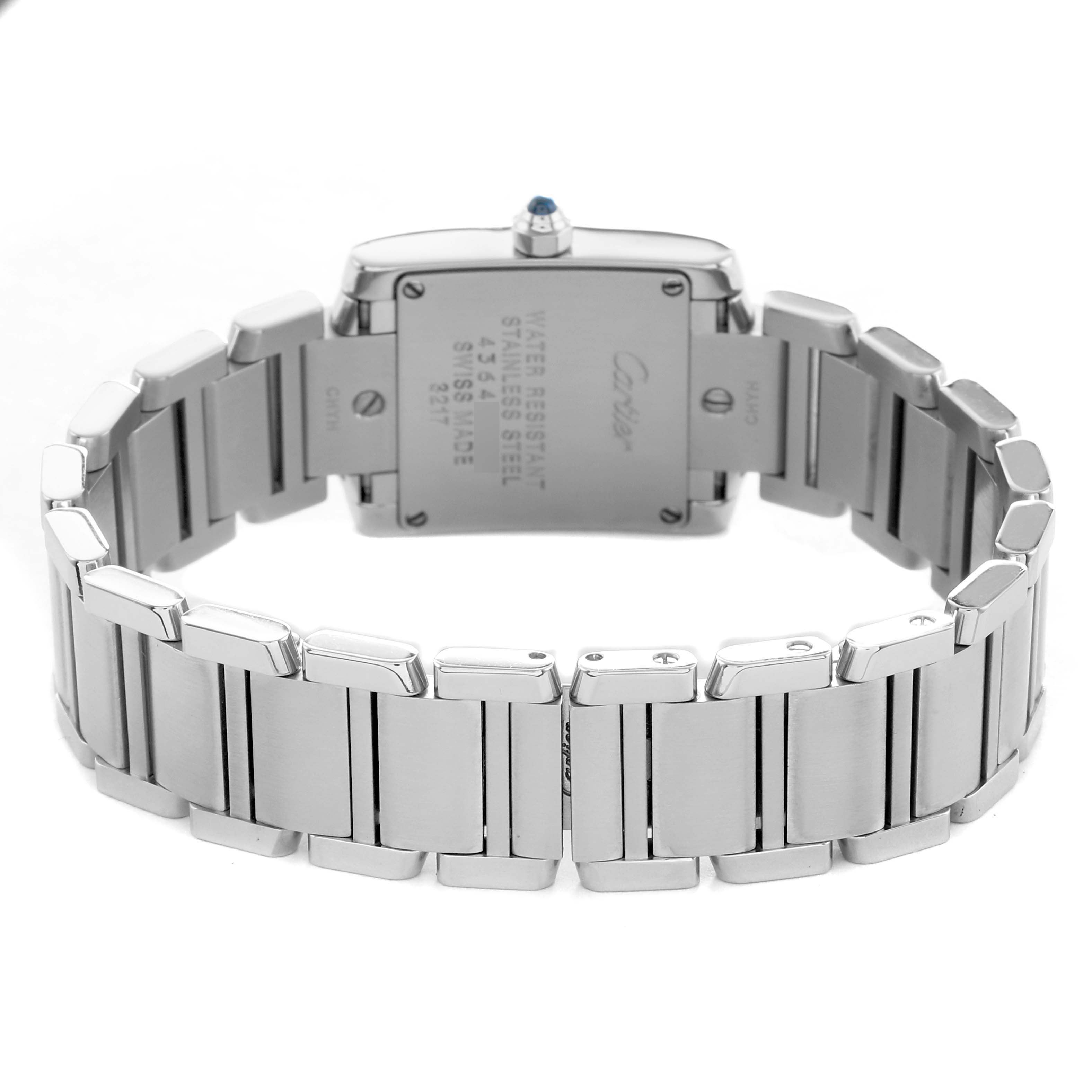 The Cartier Tank Française watch is shown from the back, highlighting its metal bracelet and case back details.