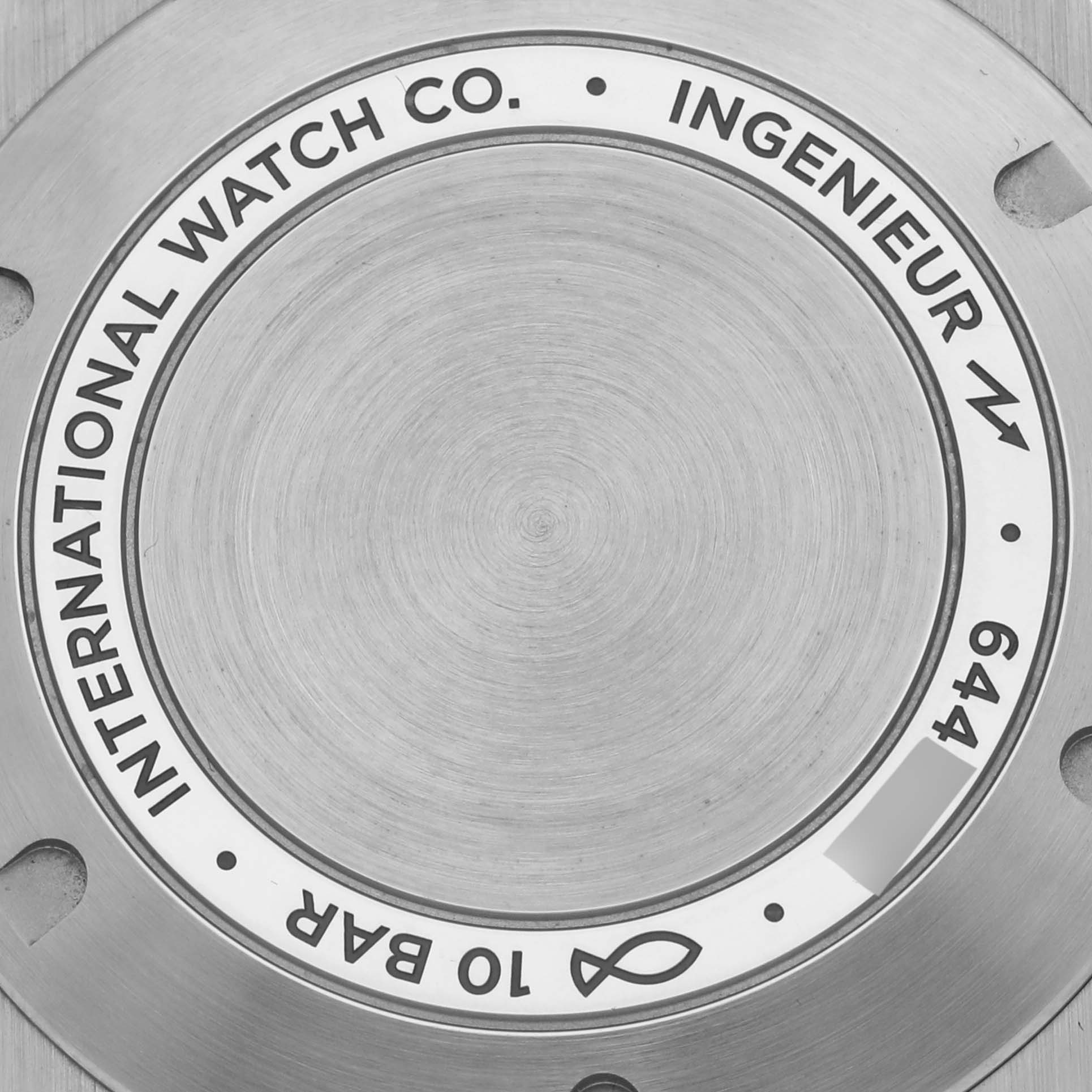 The image shows the back case of the IWC Ingenieur IW328902 Men's Stainless Steel Silver Dial IW328902 Men's Stainless Steel Silver Dial watch, featuring brand markings.
