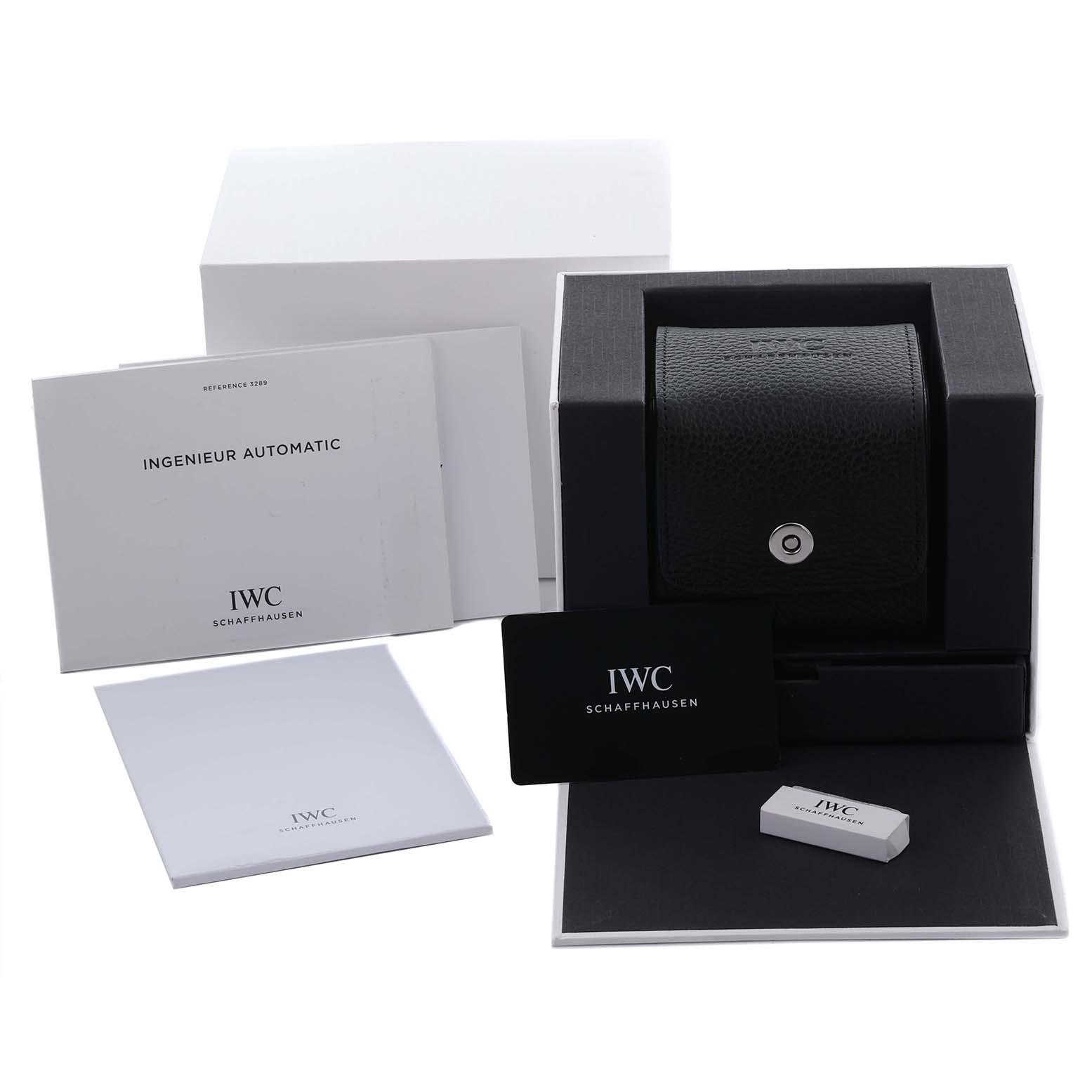 The image shows the IWC Ingenieur IW328902 Men's Stainless Steel Silver Dial IW328902 Men's Stainless Steel Silver Dial watch accessories, including a box, booklets, a card, and an outer case.