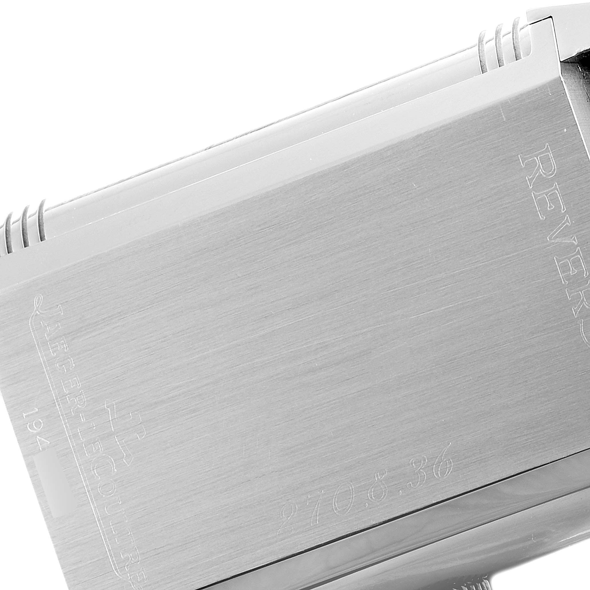 This image shows a close-up of the side of a Jaeger-LeCoultre Reverso watch, highlighting part of the case with engraved branding.