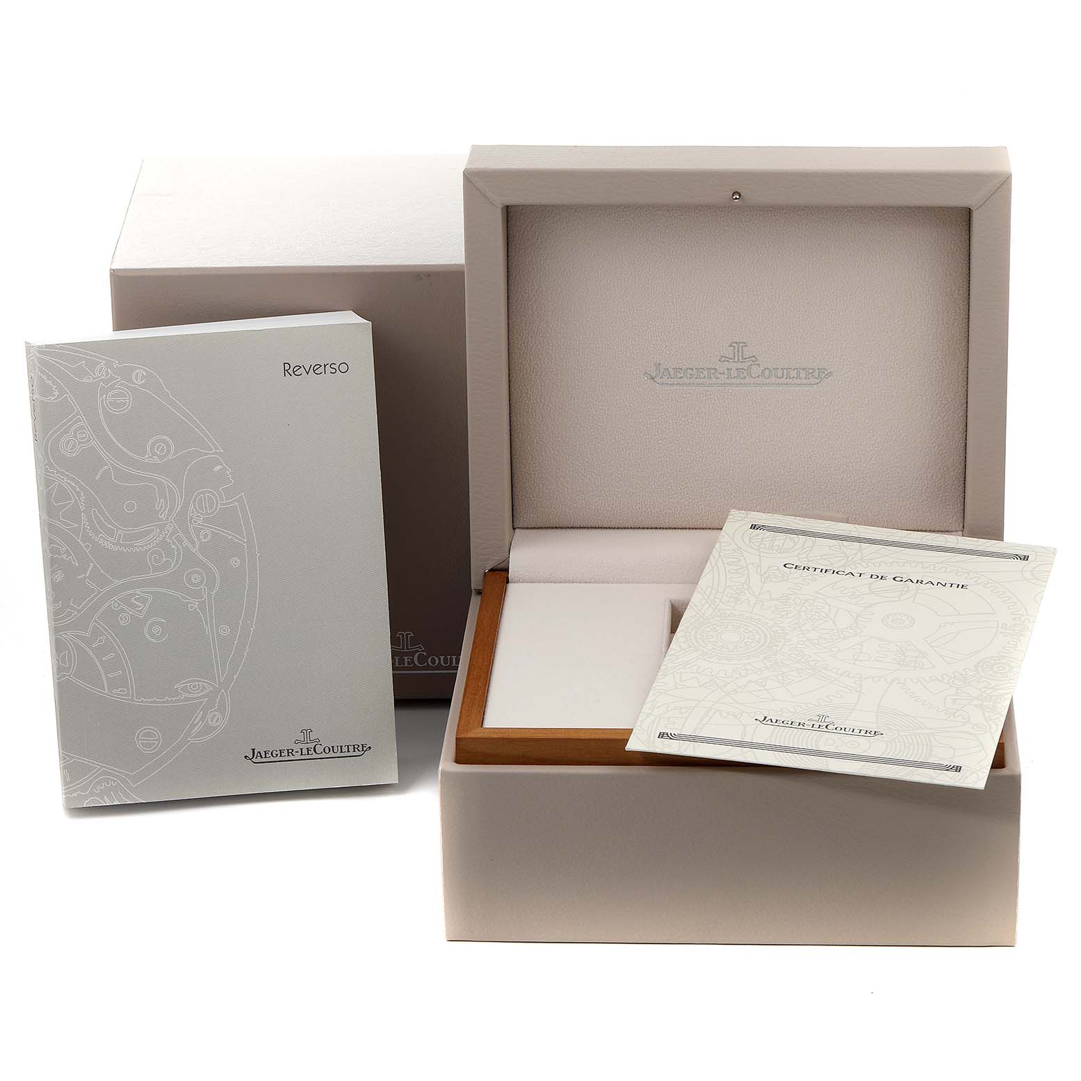 This image shows the packaging, manuals, and certificate for a Jaeger LeCoultre Reverso 270.8.36 Men's Stainless Steel Silver Dial 270.8.36 Men's Stainless Steel Silver Dial watch.