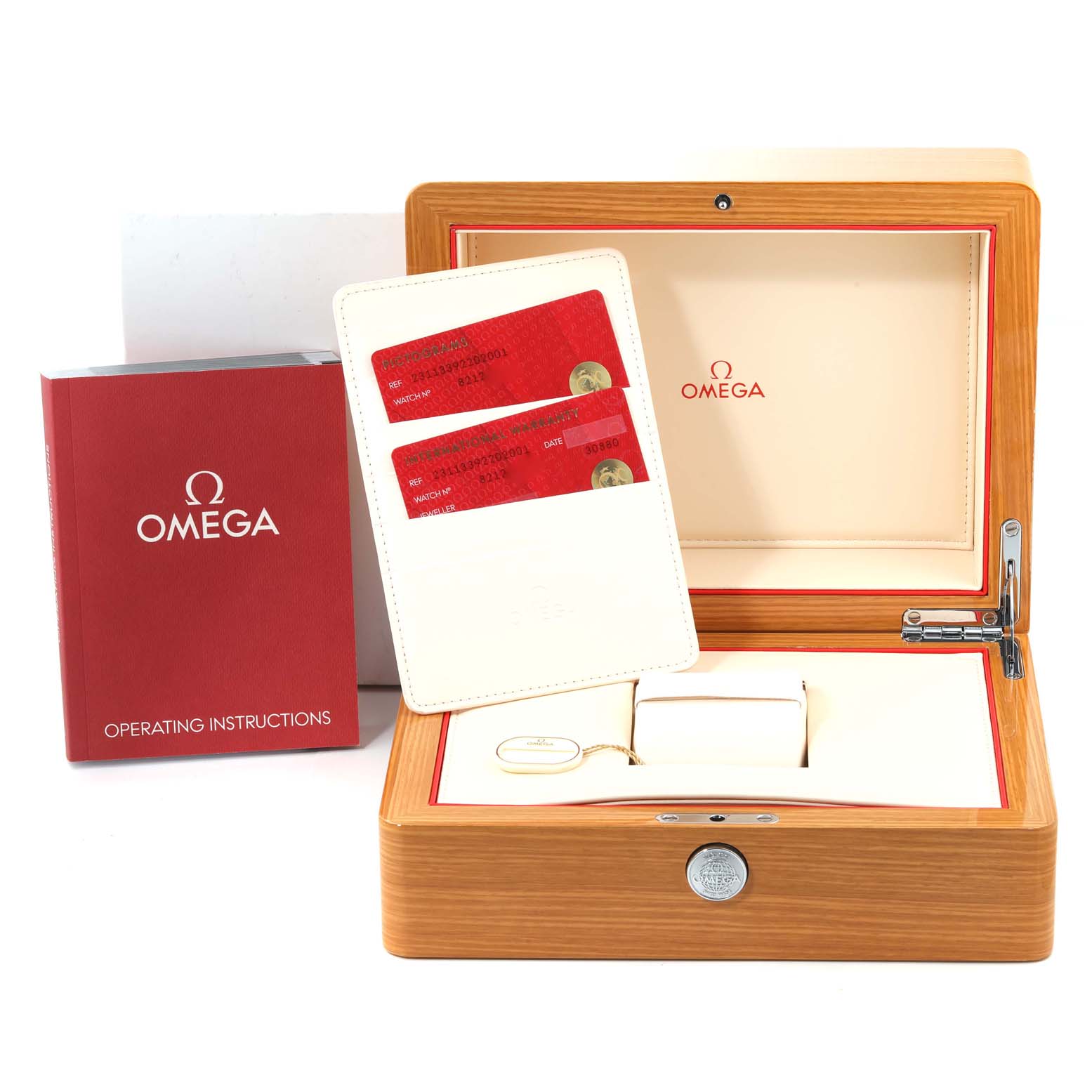 The image shows accessories for the Omega Aqua Terra 231.13.39.22.02.001 Men's Stainless Steel Silver Dial 231.13.39.22.02.001 Men's Stainless Steel Silver Dial watch, including a wooden box, warranty cards, and an operating instructions booklet.