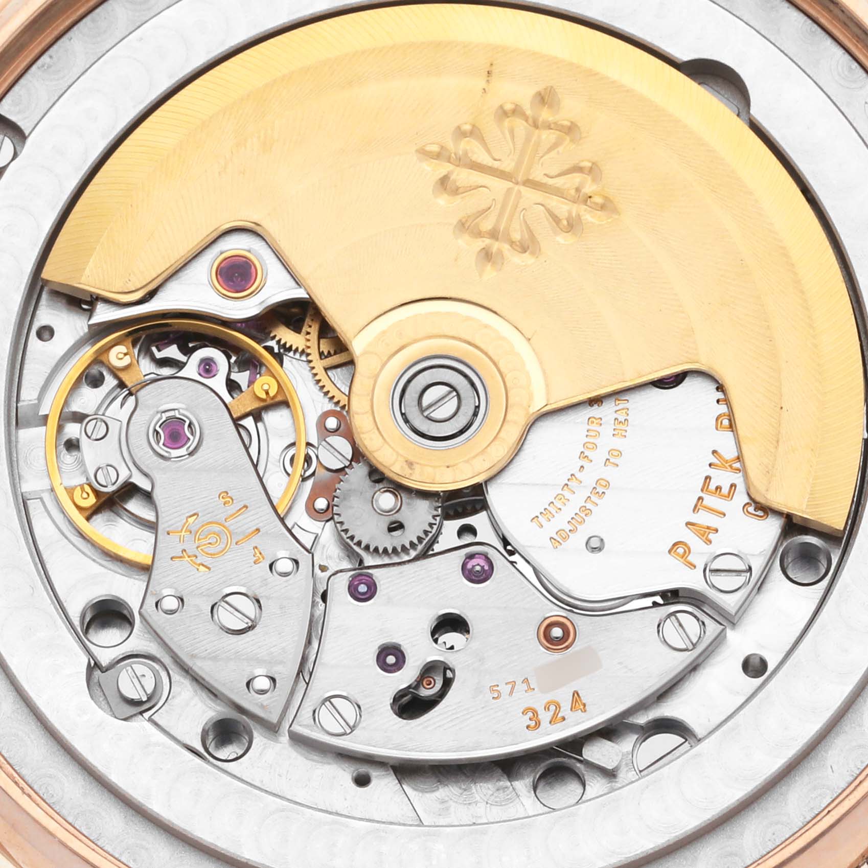 The image shows a close-up of the movement mechanism of a Patek Philippe Complications 5396R-011 Men
s Rose Gold Silver Dial 5396R-011 Men
s Rose Gold Silver Dial watch.
