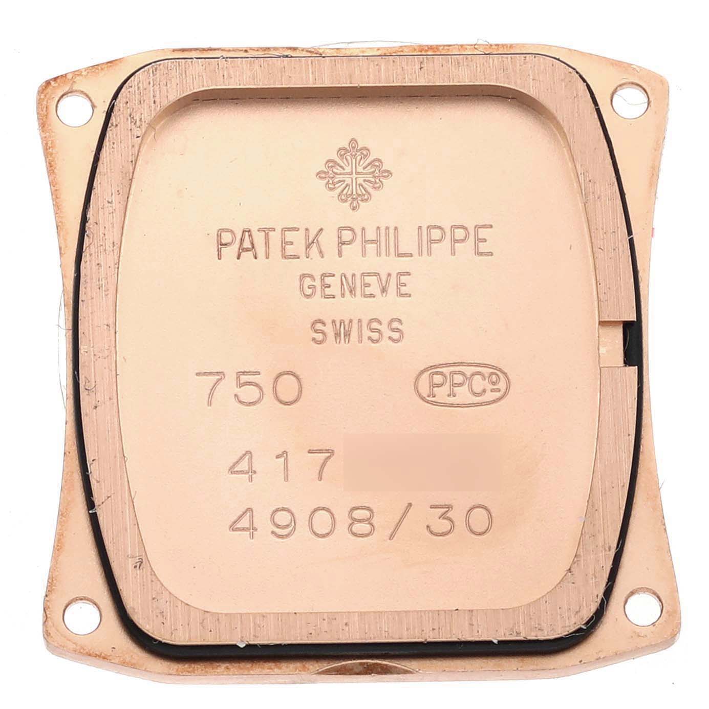 The image shows the backplate of a Patek Philippe Twenty-4 4908/30R-011 Women's Rose Gold Silver Dial 4908/30R-011 Women's Rose Gold Silver Dial watch, focusing on its inscriptions and serial details.