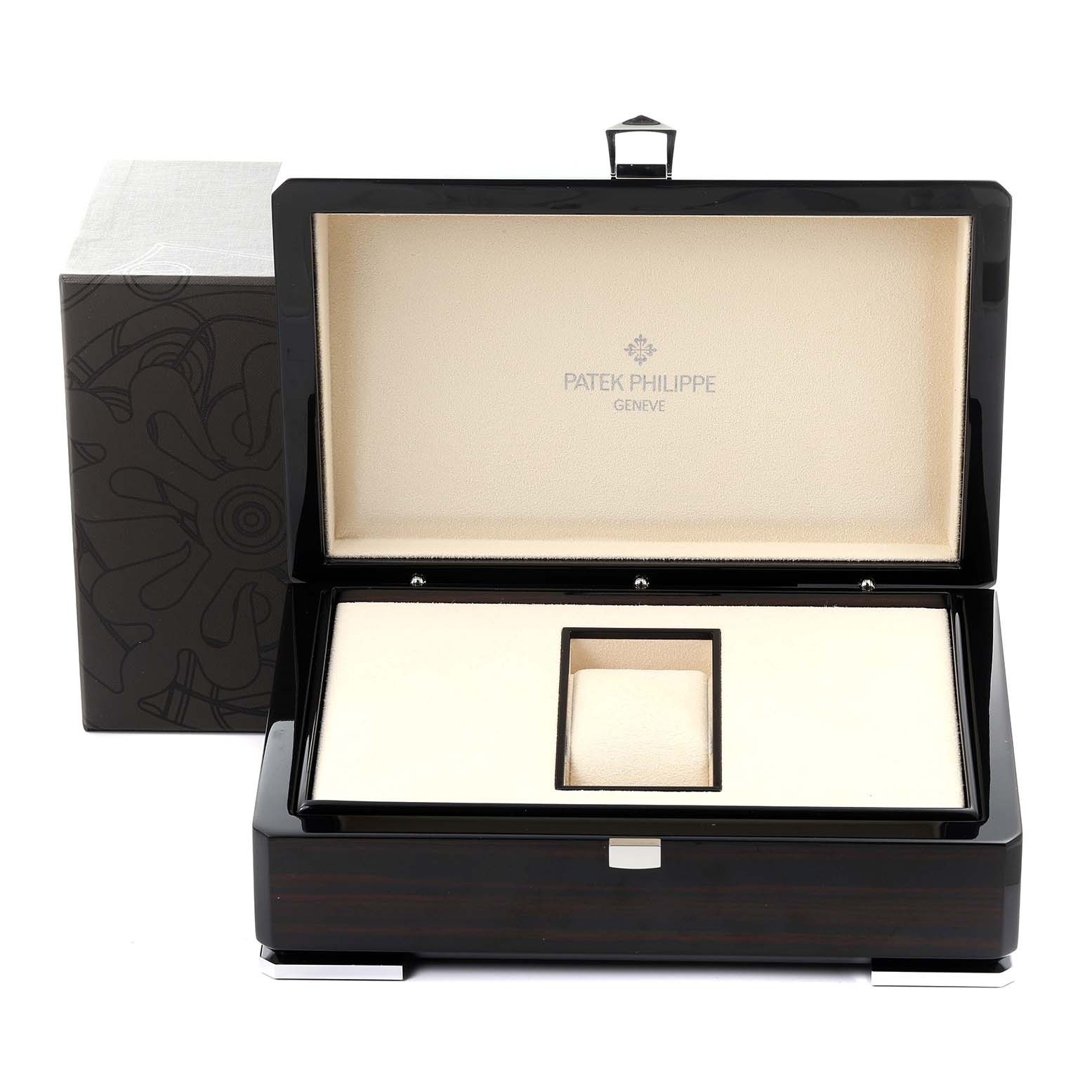 The image shows a Patek Philippe Complications 5230R-001 Men's Rose Gold Silver Dial 5230R-001 Men's Rose Gold Silver Dial watch box, open from a front angle, displaying its interior lining and compartments.