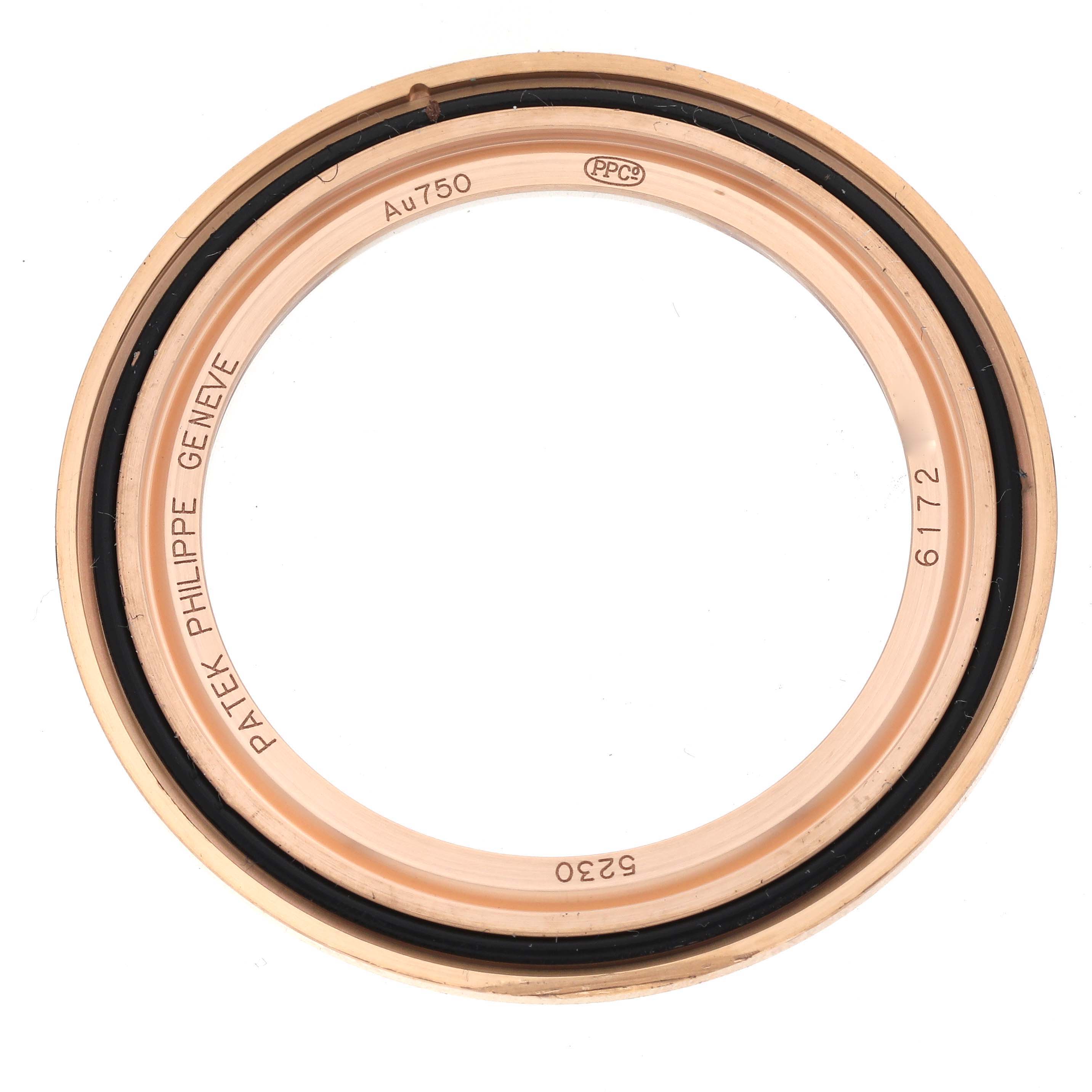 This image shows the bezel of a Patek Philippe Complications 5230R-001 Men's Rose Gold Silver Dial 5230R-001 Men's Rose Gold Silver Dial watch, highlighting the inner markings and material.