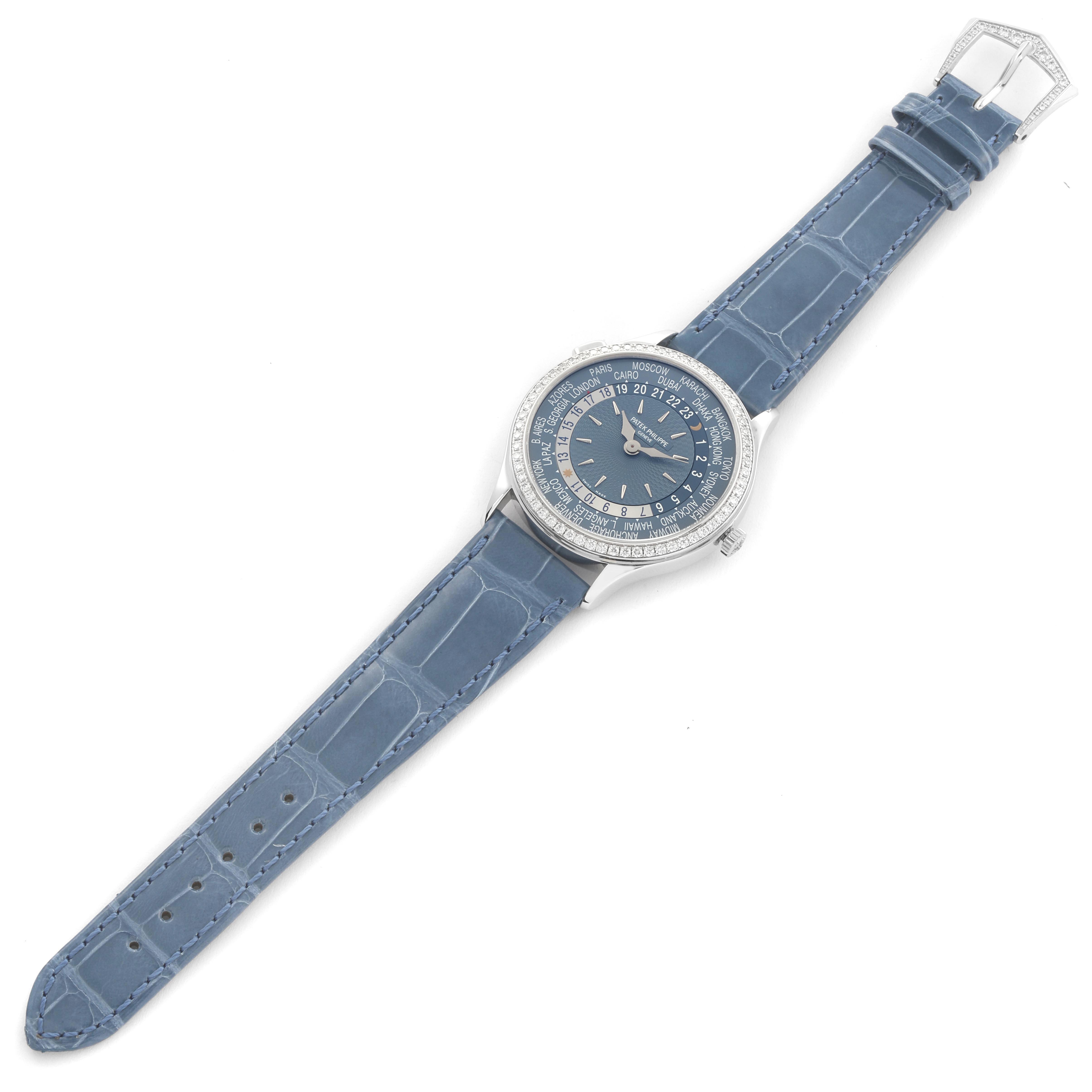 The Patek Philippe Complications 7130G-014 Men's White Gold Blue Dial watch is shown from a top-down angle, displaying its blue dial and leather strap.