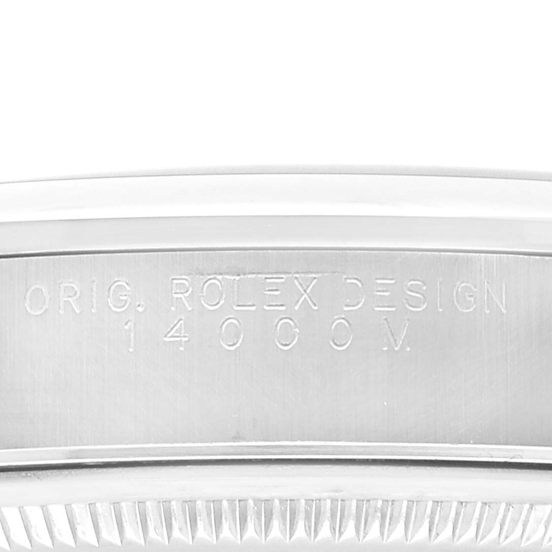 This image shows a close-up of the side engraving on a Rolex Air-King 14000 Men's Stainless Steel White Dial 14000 Men's Stainless Steel White Dial model watch, highlighting the serial number and design details.